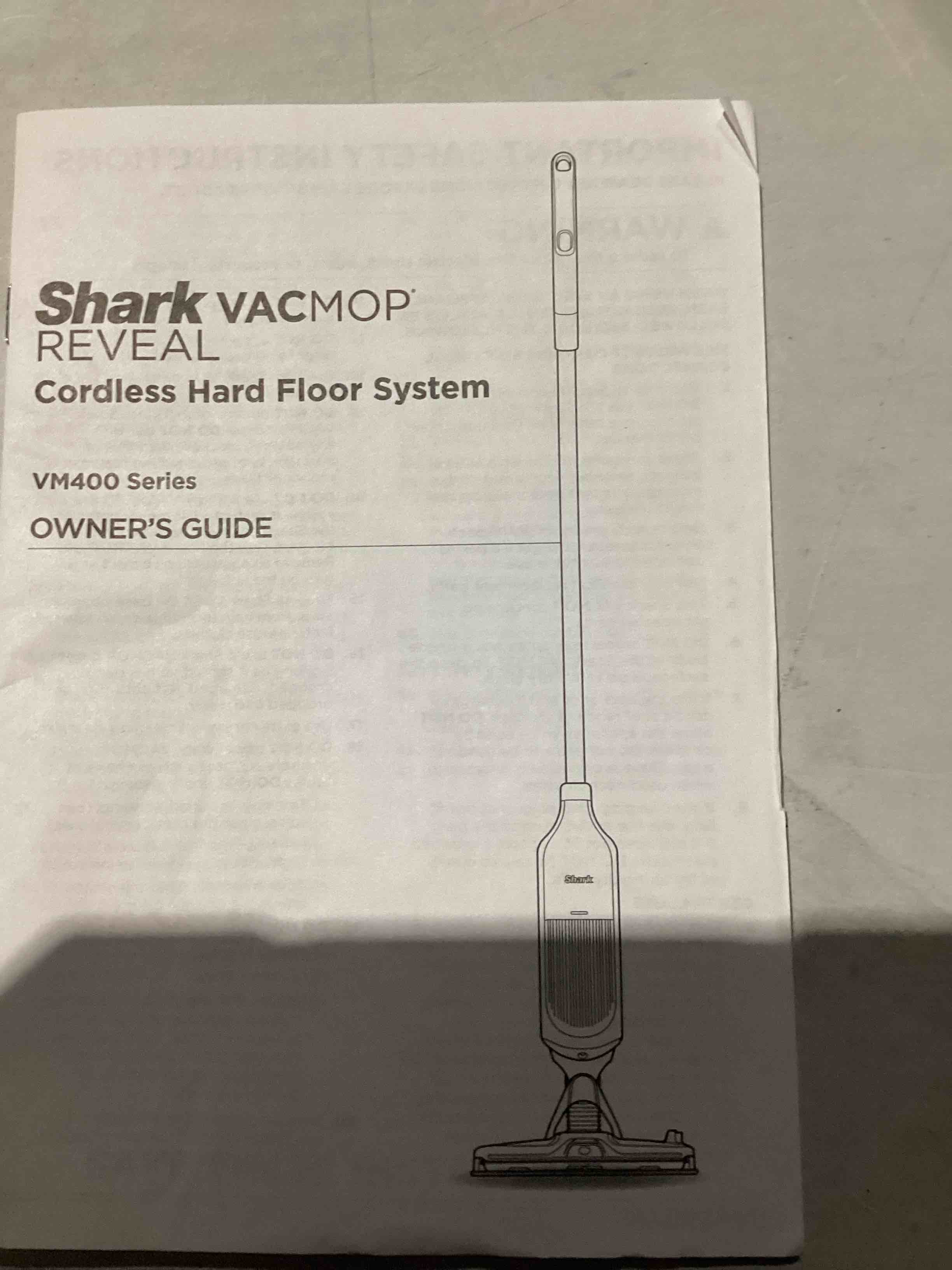Condition photo showing As Is for shark vacmop reveal cordless hard floor system