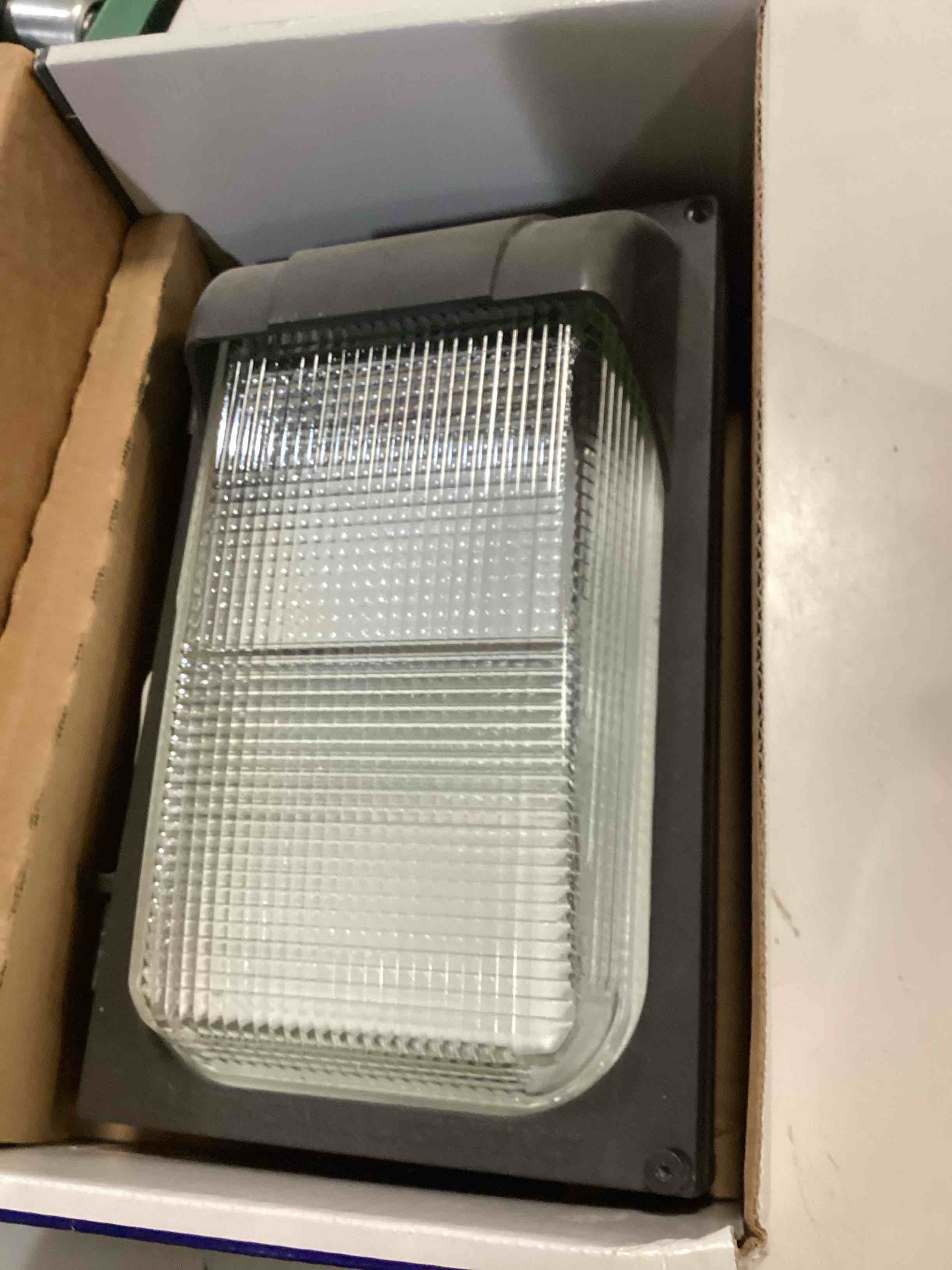 Condition photo showing As Is for lithonia lighting led size 1 wallpack twx1 led p2 50k mvolt pe ddbtxd