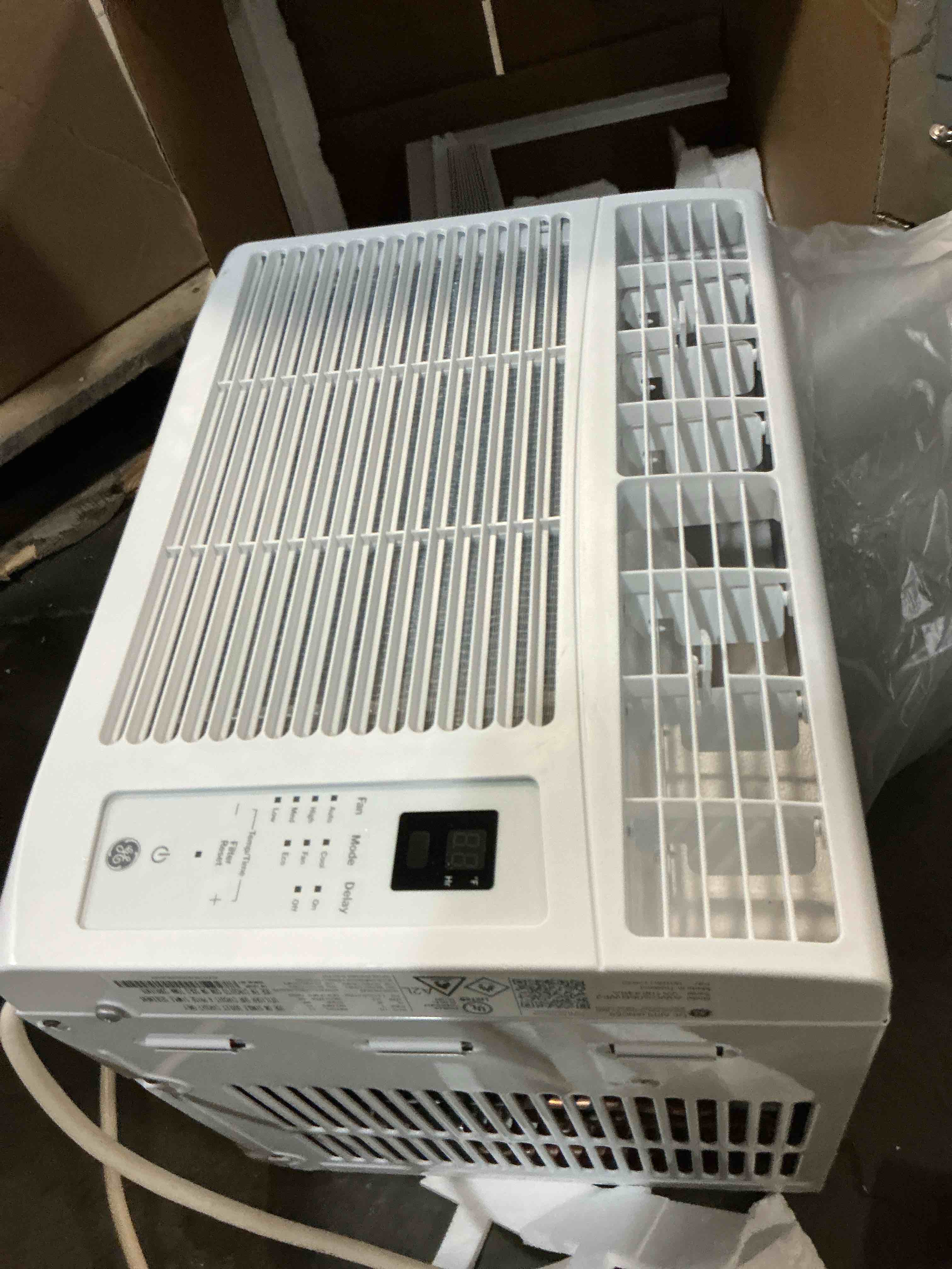 Condition photo showing As Is for ge appliances 6000 btu electronic window air conditioner unit