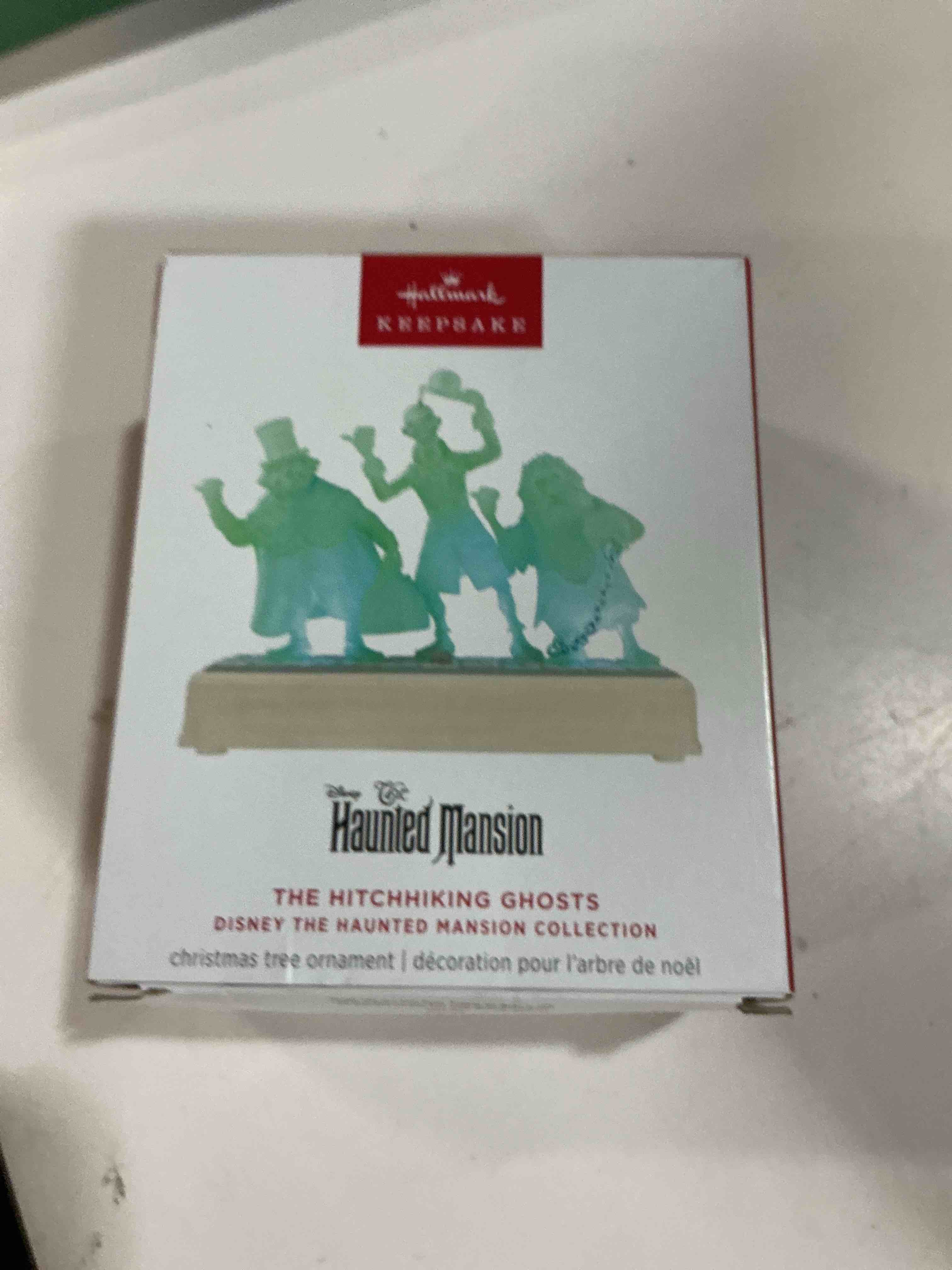 Condition photo showing New/Like New for hallmark keepsake christmas ornament, disney the haunted mansion collection the hitchhiking ghosts with light and sound