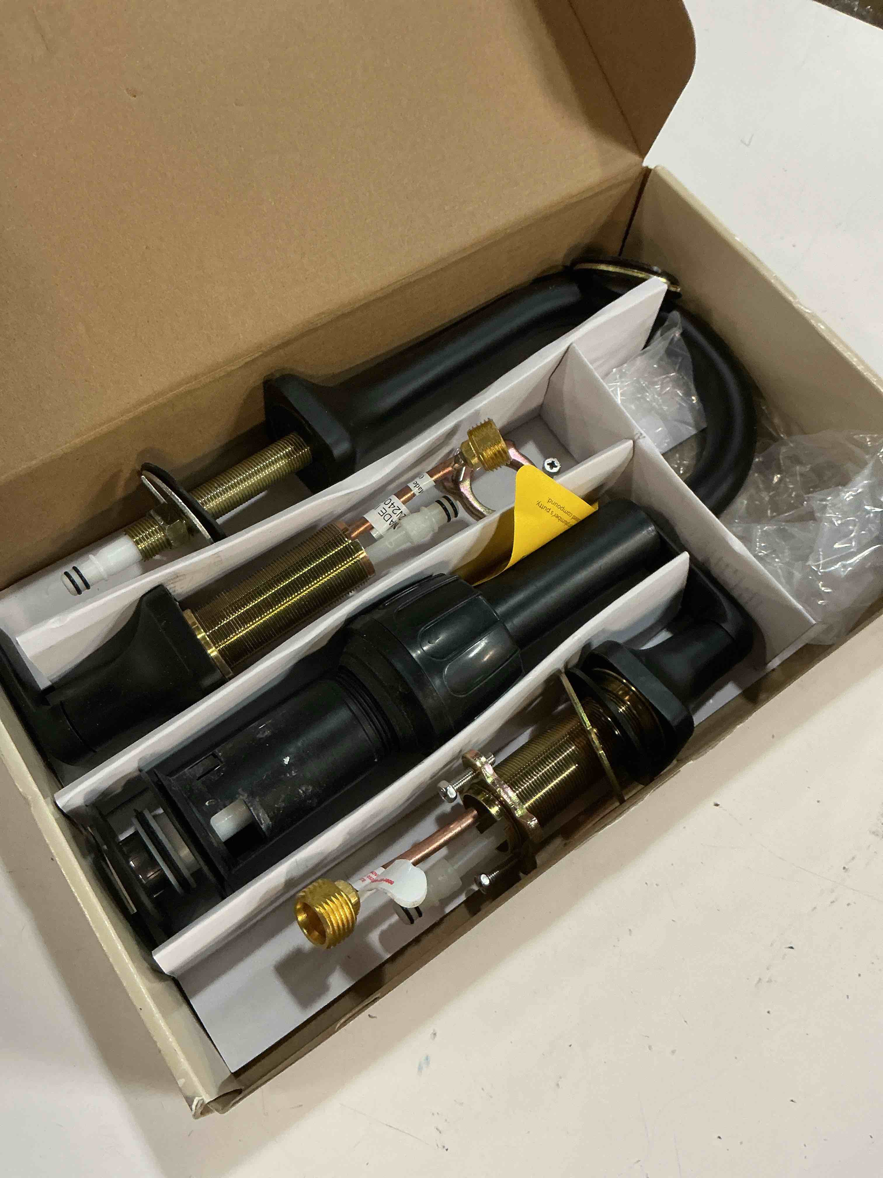 Condition photo showing As Is for allen + roth dunmore matte black widespread 2-handle watersense high-arc residential handle