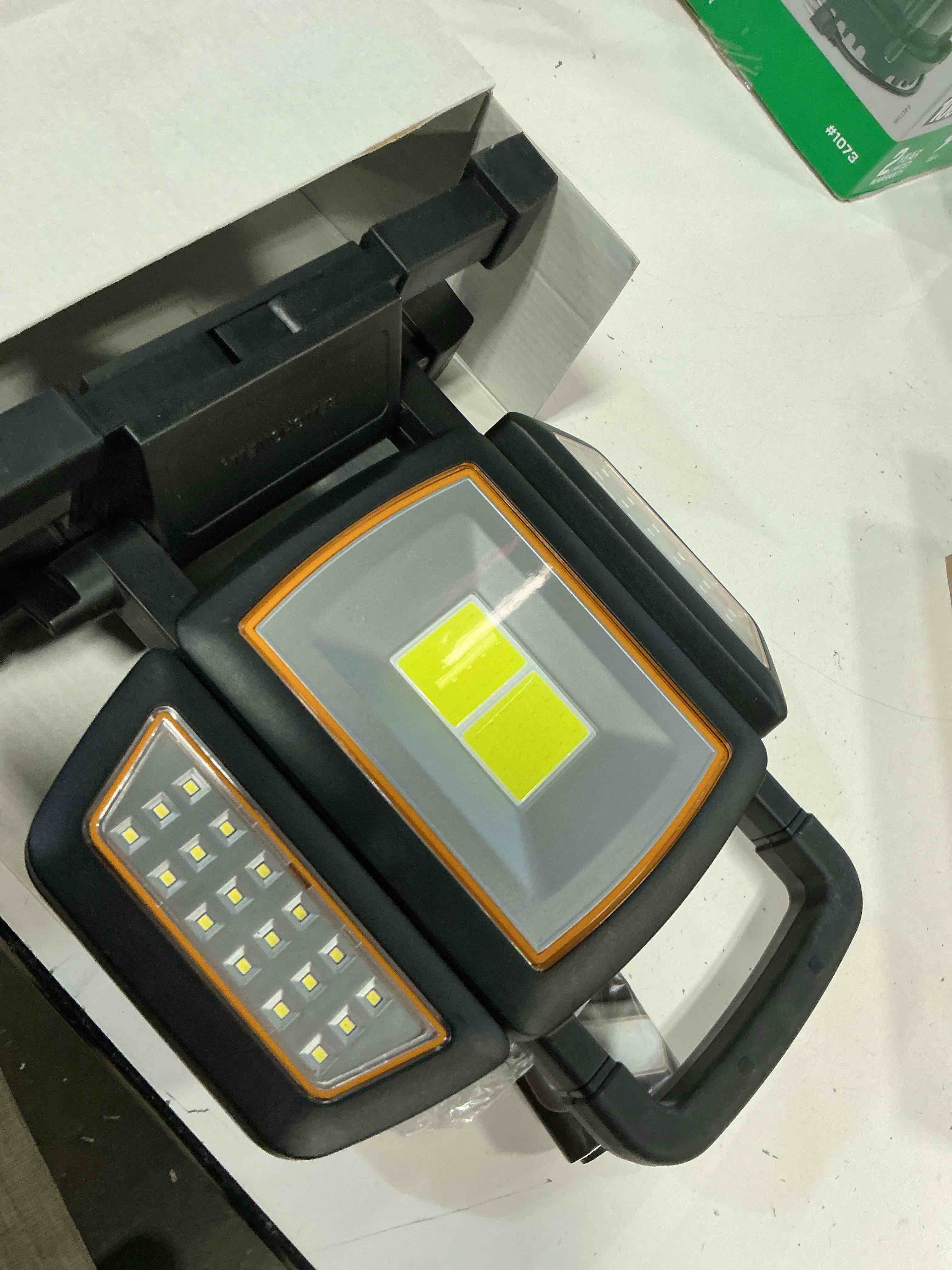 Condition photo showing As Is for bell+howell work light portable rechargeable work lights1500 lumens as seen on tv