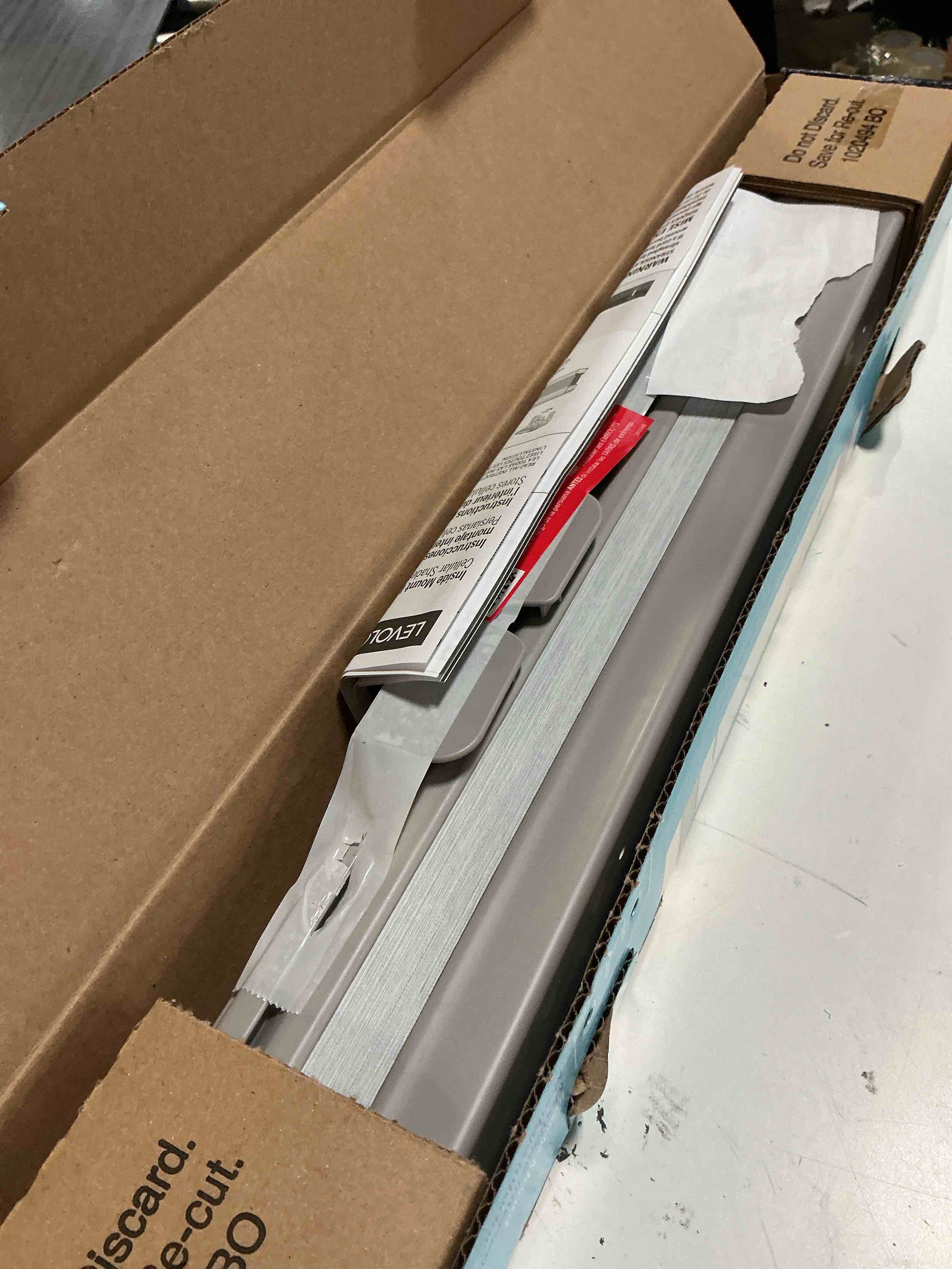 Condition photo showing As Is for levolor 24-in x 72-in graphite blackout cordless cellular shade