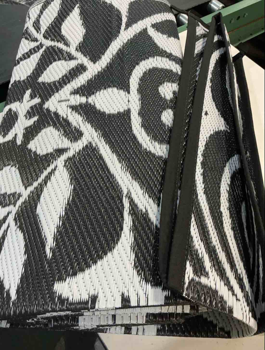 Condition photo showing Good Condition for (unknown size) outdoor rug waterproof clearance, reversible outdoor plastic straw rug with floral pattern, rv mat for patio, camping, balcony, deck, backyard, black & white
