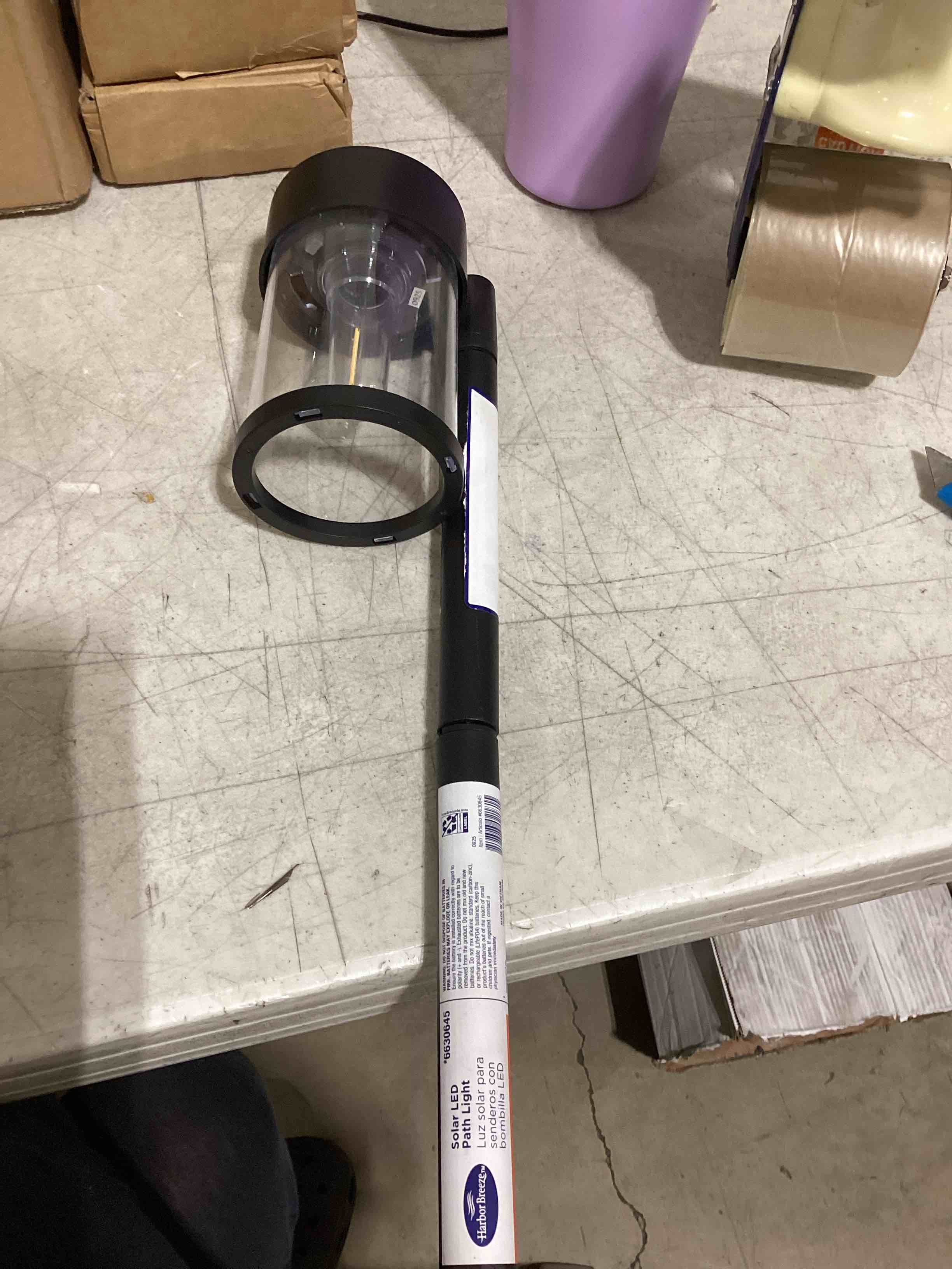 Condition photo showing As Is for harbor breeze 10 -lumens black solar led outdoor path light 2732-k