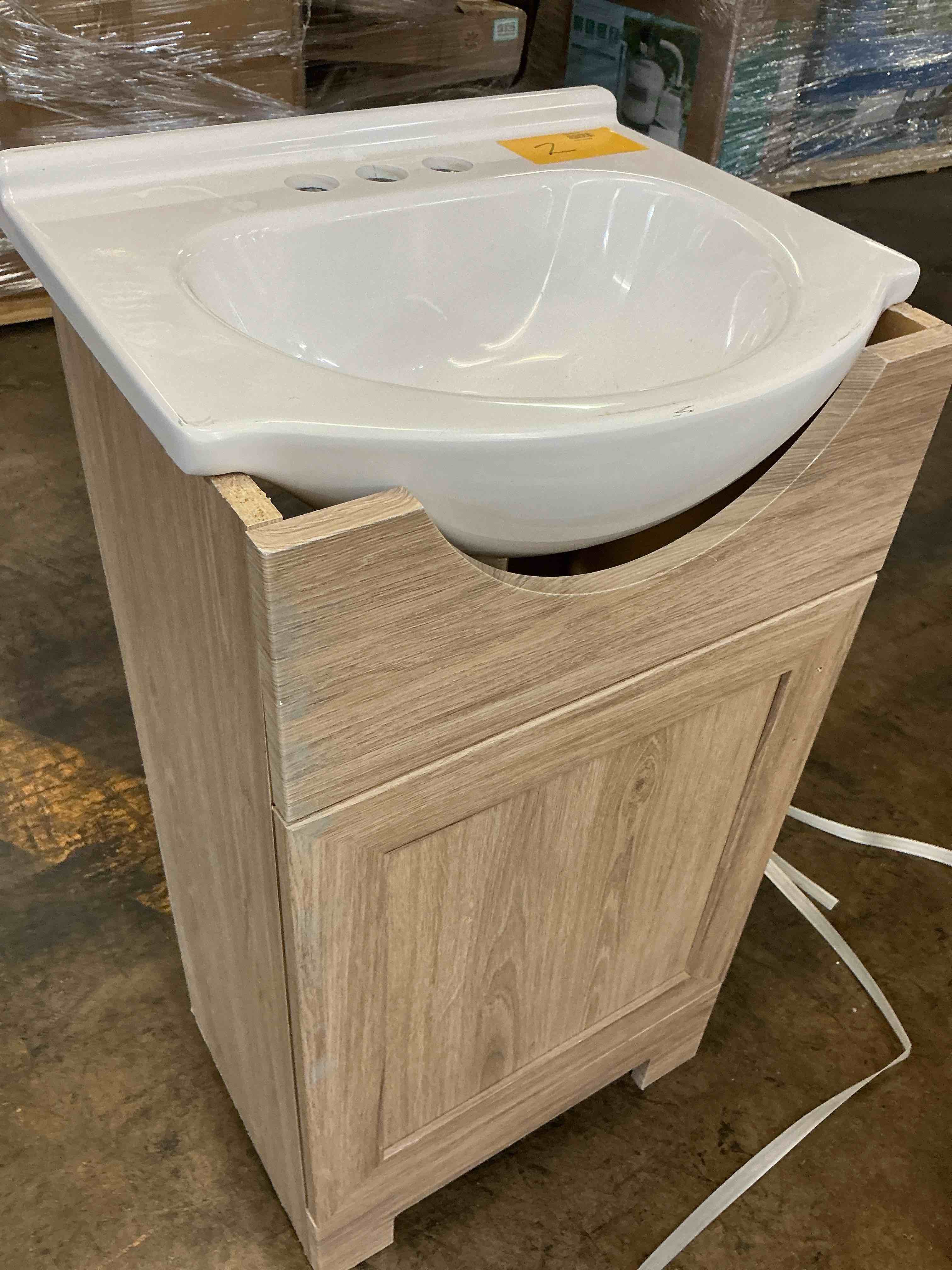 Condition photo showing As Is for project source euro 24-in sandstone single sink bathroom vanity with white cultured marble