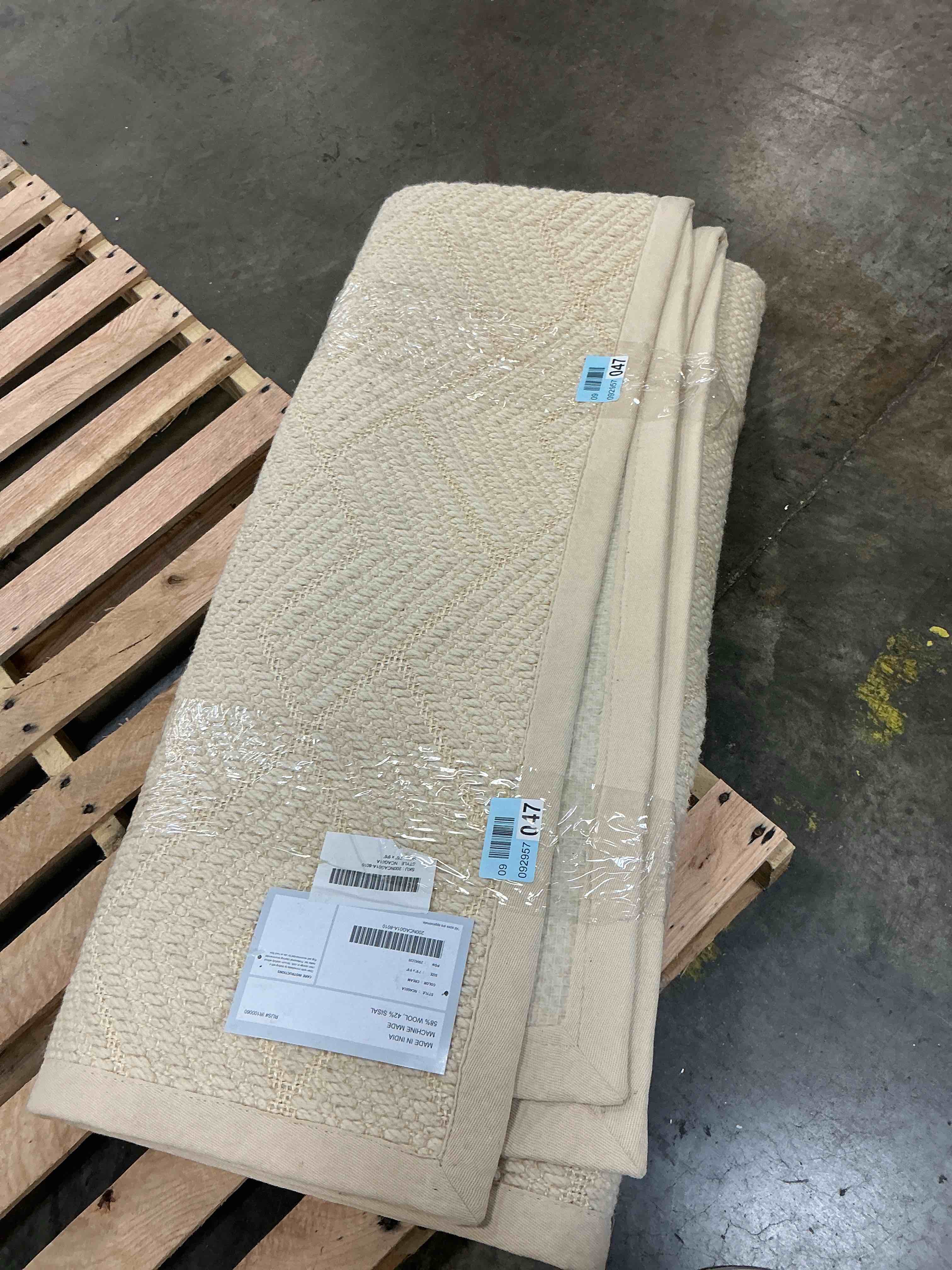Condition photo showing As Is for nuloom suzanne 7’6x9’6 loomed wool cream rectangular indoor solid