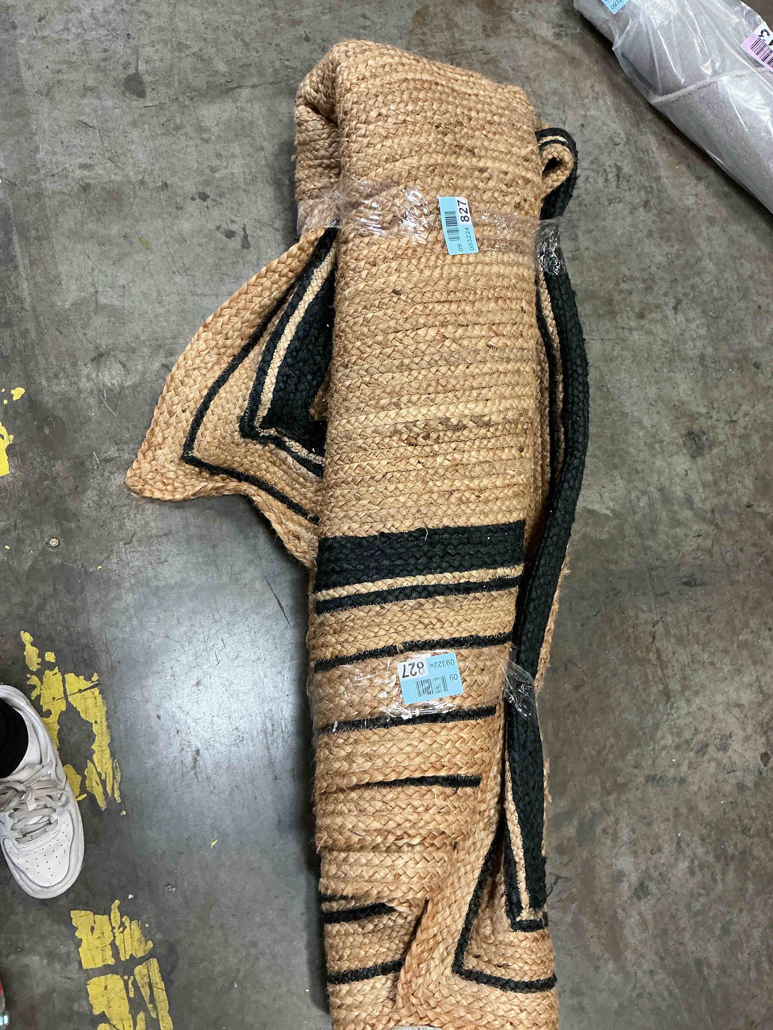 Condition photo showing As Is for handmade jute braided rug | black border, eco-friendly fiber