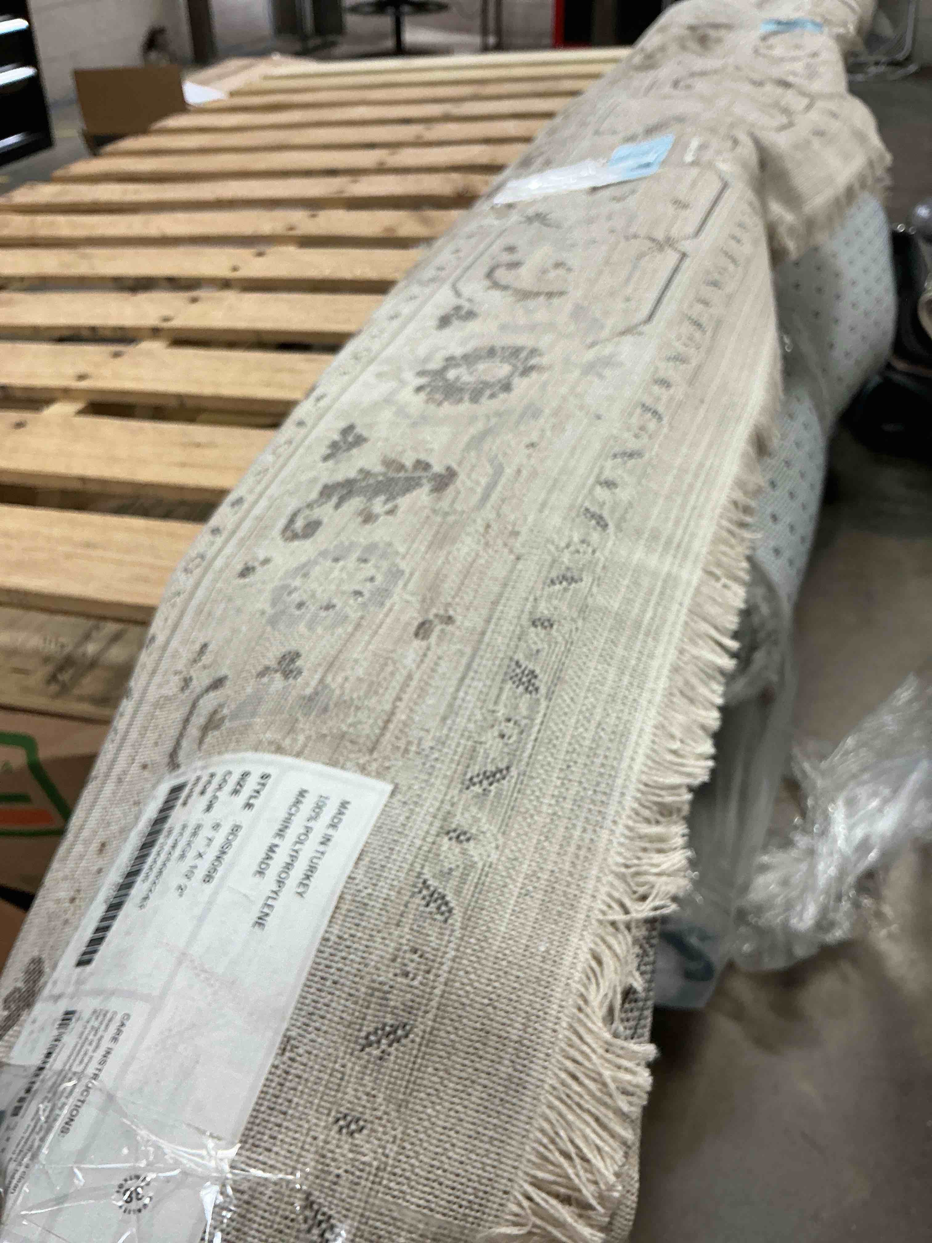 Condition photo showing As Is for oliveira beige 6’7x10’2 floral medallion fringe area rug