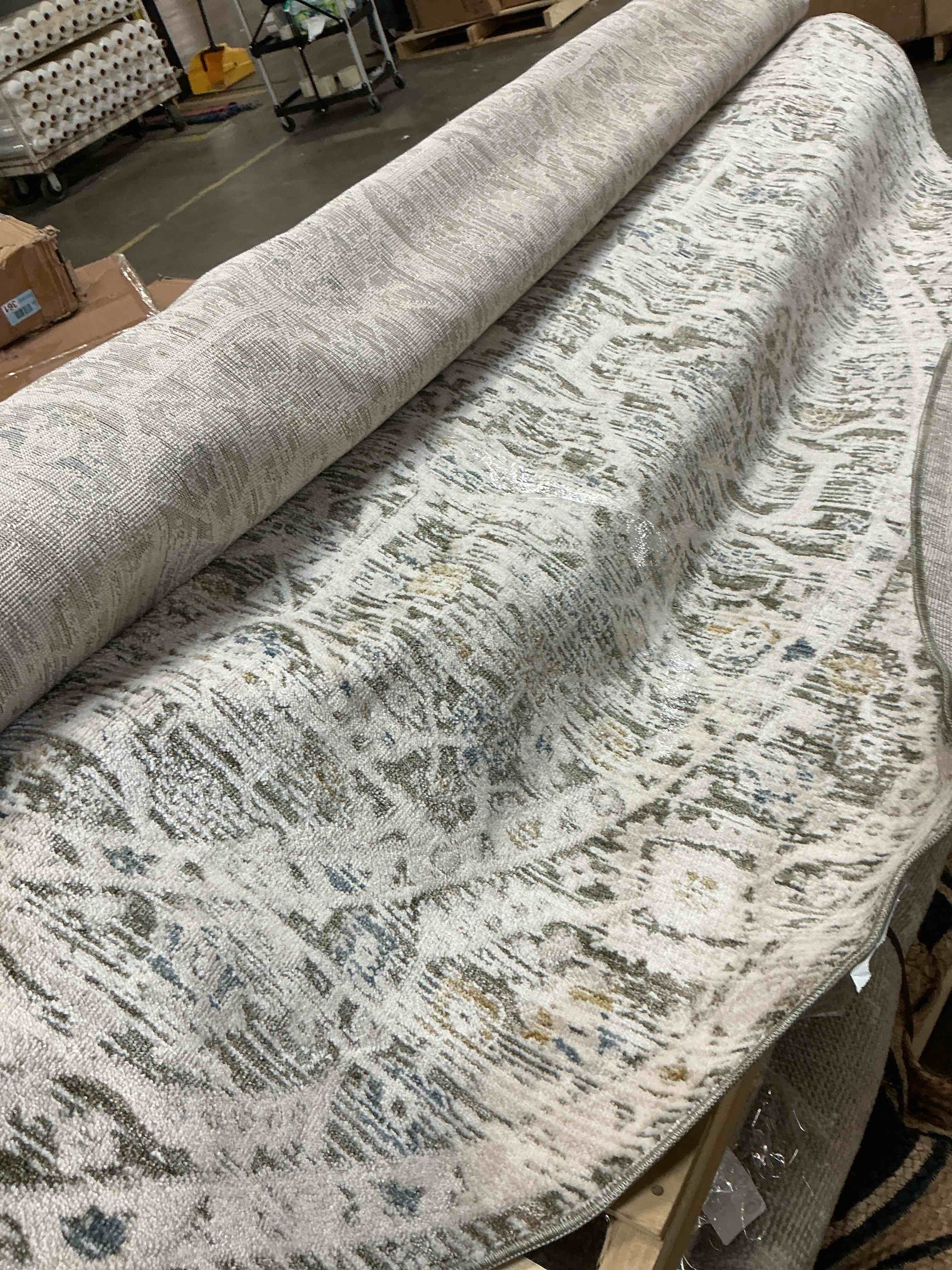 Condition photo showing As Is for round abstract area rug