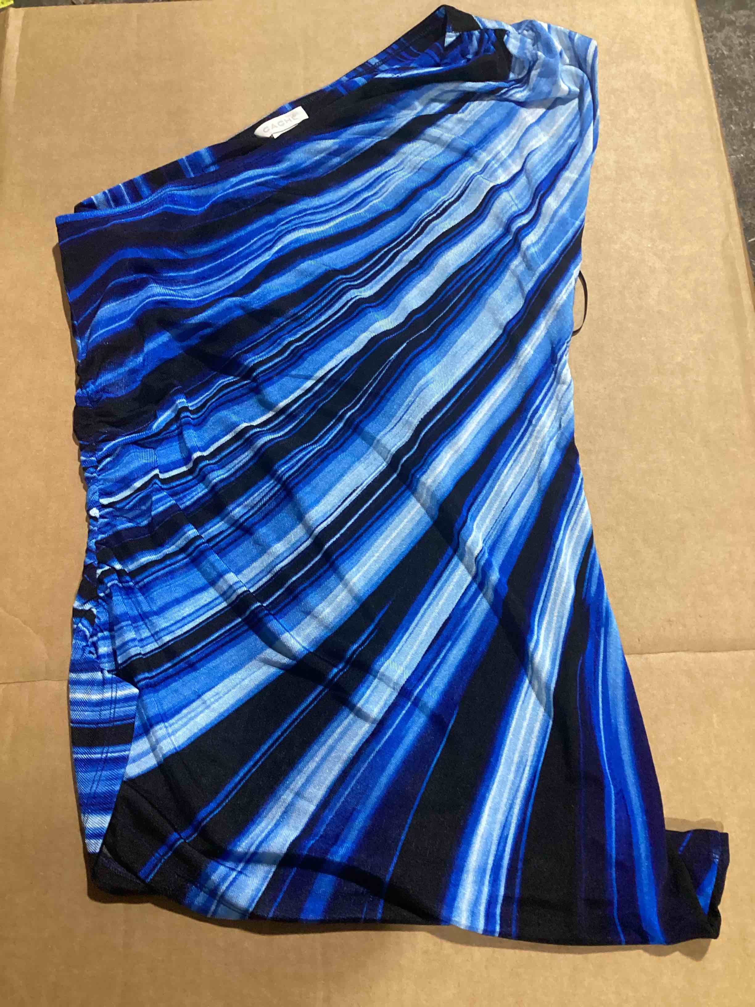 Condition photo showing New/Like New for case of 50 size medium cache blue and black stripe top off one shoulder