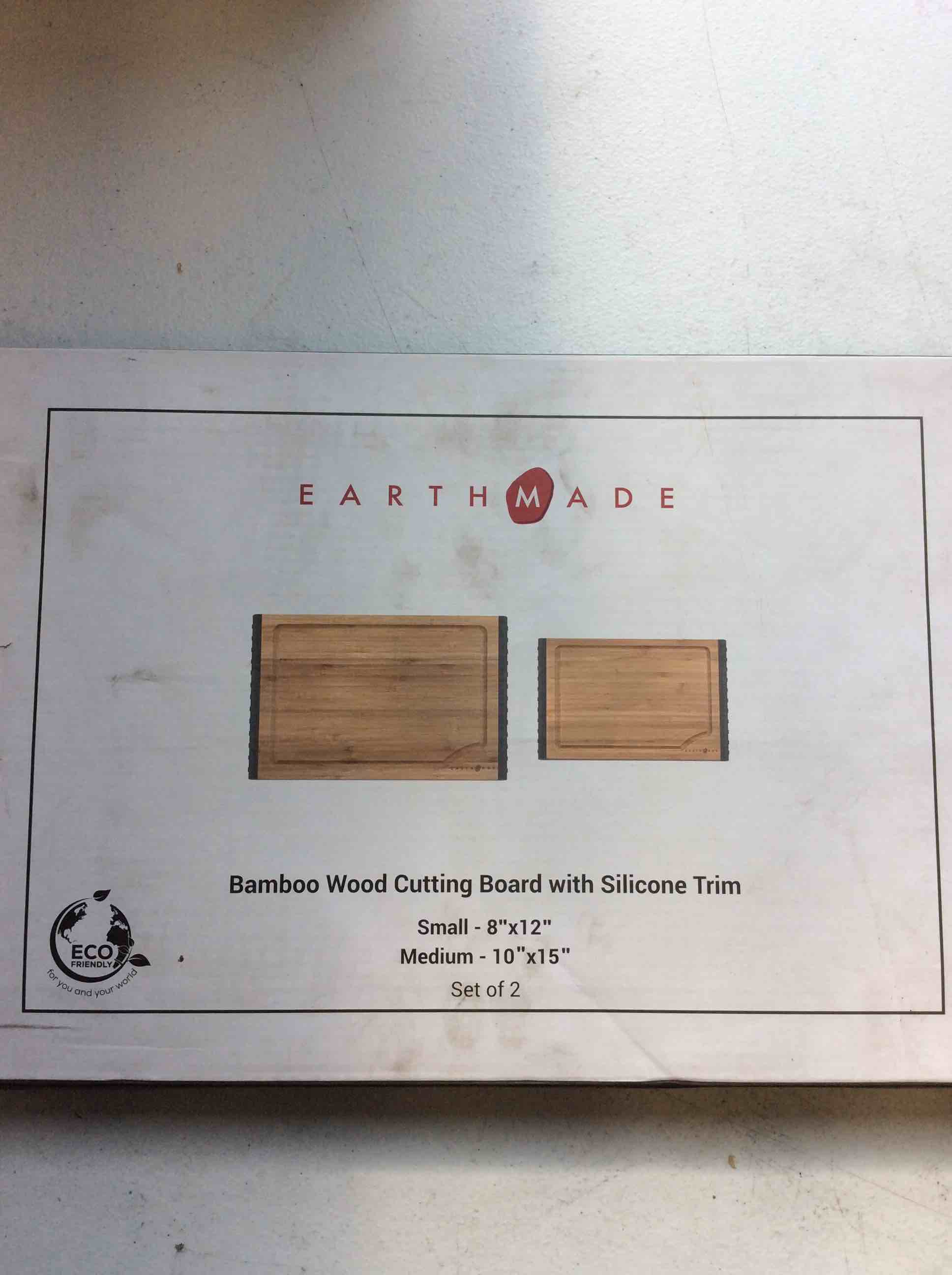 Condition photo showing New/Like New for earthmade bamboo wood cutting board with silicone trim small- 8” x 12” medium- 10” x 15” set of two