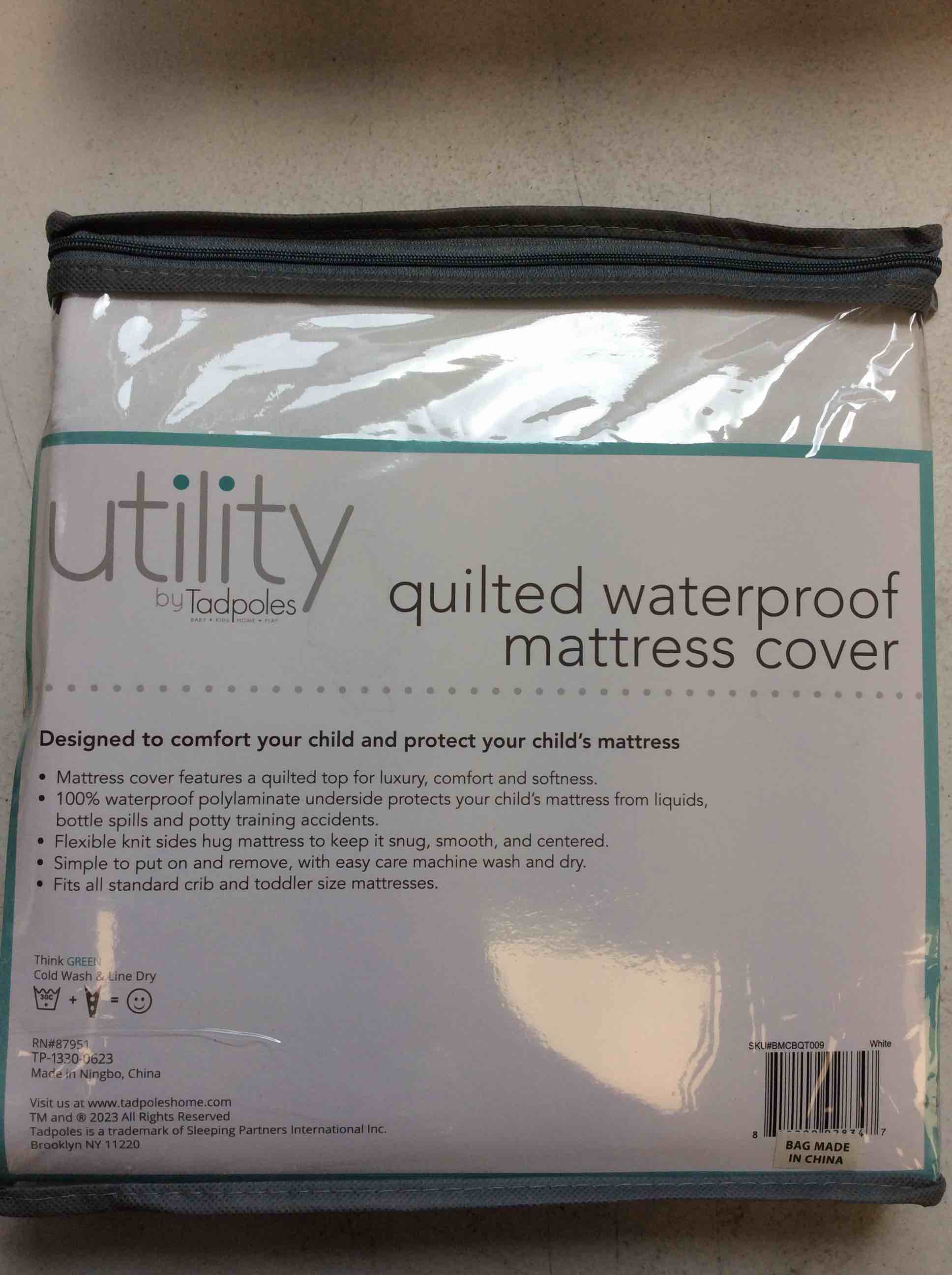 Condition photo showing New/Like New for utility by tadpoles quilted waterproof mattress cover crib 28” x 52” x 9”