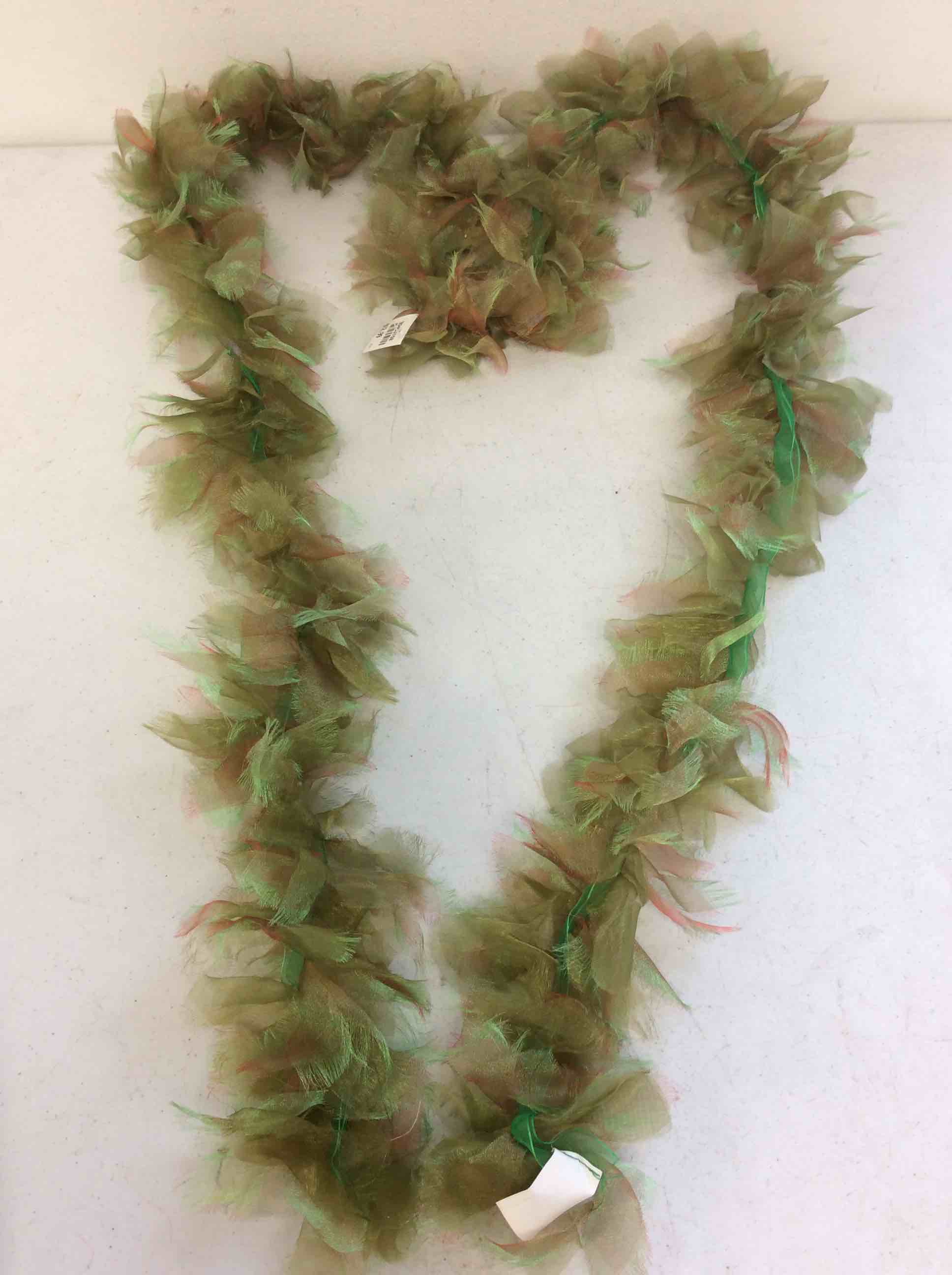 Condition photo showing New/Like New for box of green boas