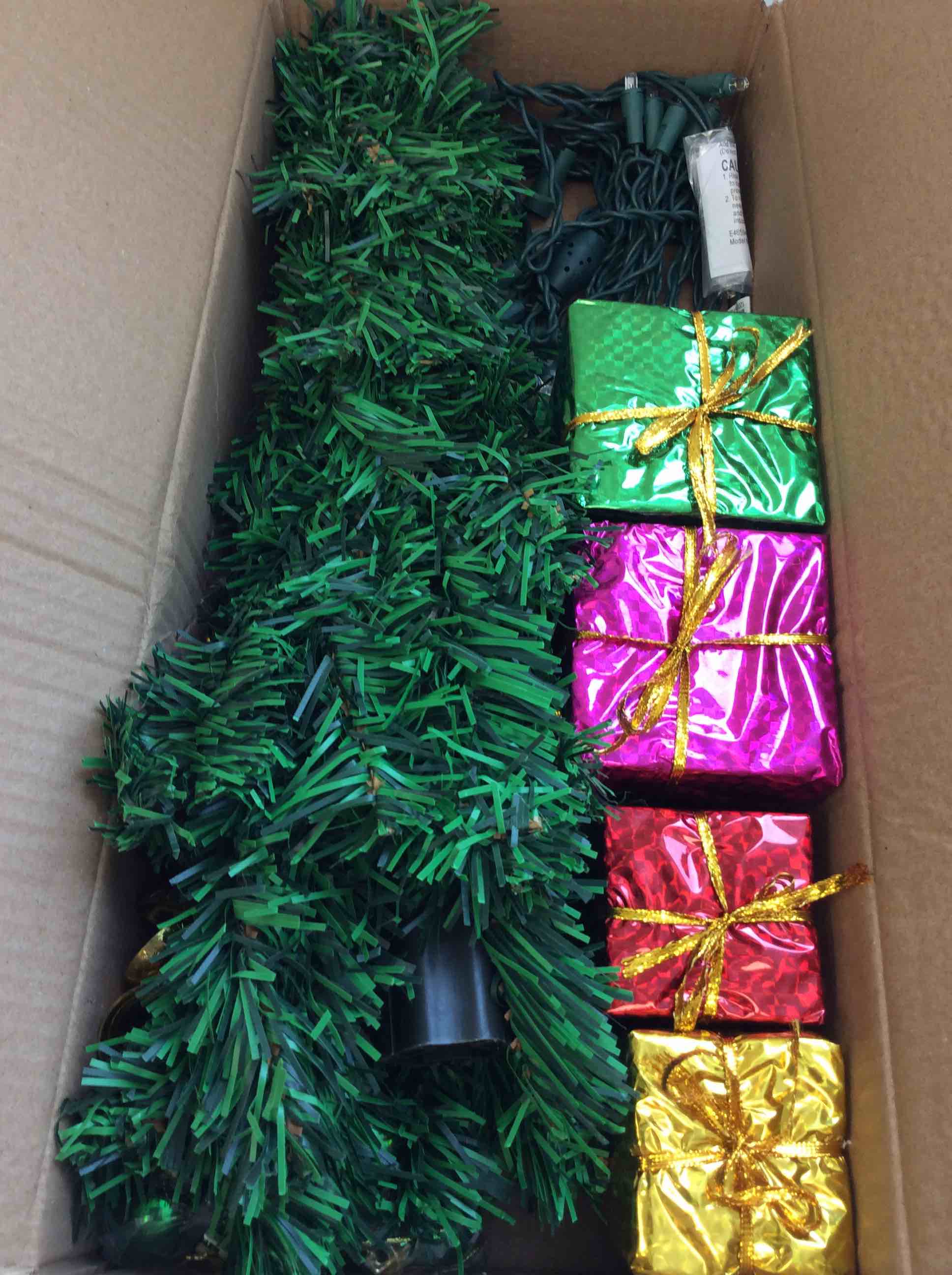 Condition photo showing New/Like New for assorted box of mini tree decorations (mini tree included)