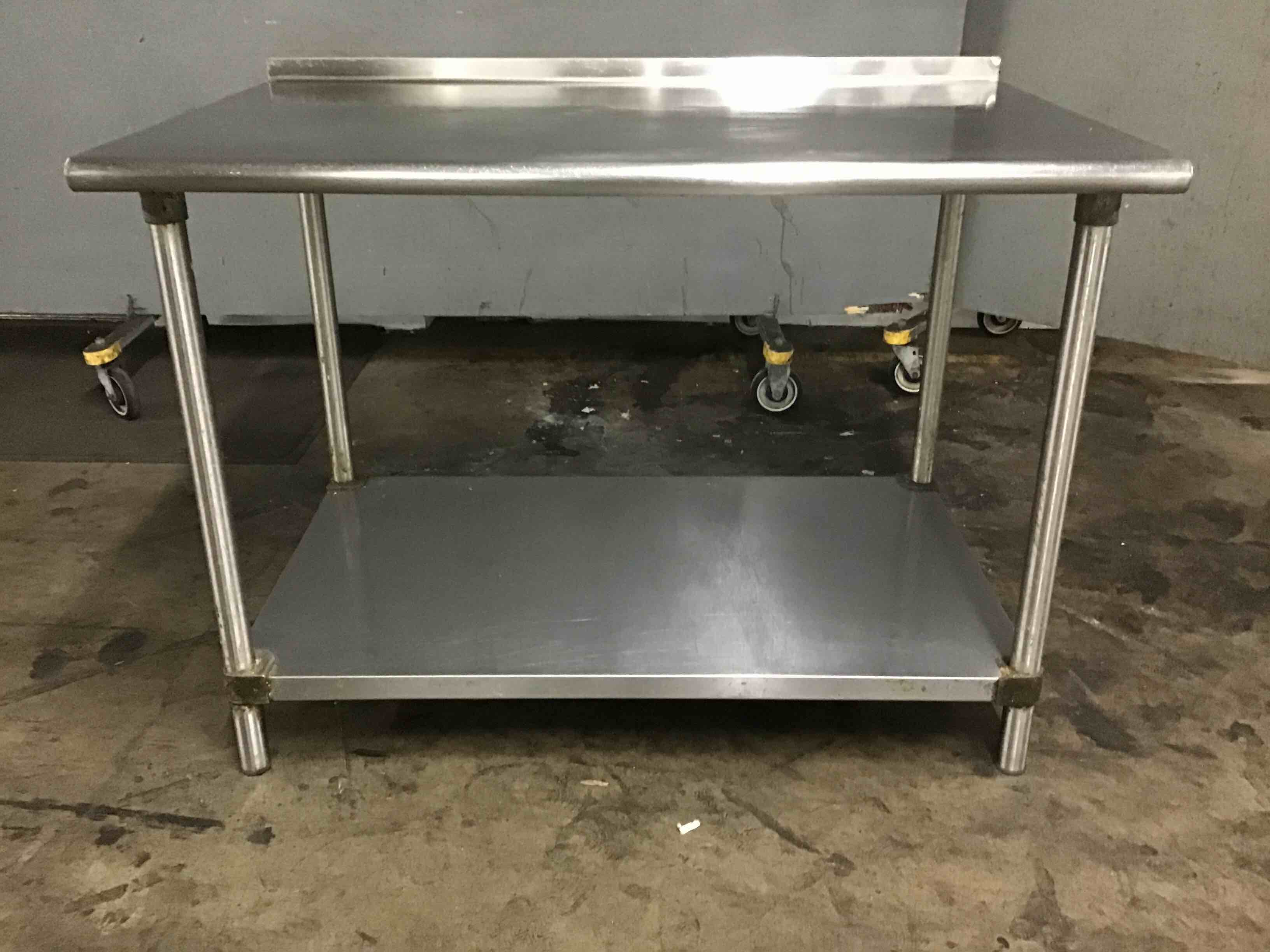Stainless Steel Table With Under Shelf And 1.5 Inch Backsplash 