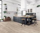 Lakeshore Pecan Stone 7mm Thick x 7-2/3 in. Wide x 50-5/8 in. Length Laminate Flooring. 16 Boxes Total, 386 Sq. Ft Total, Bid Per Sq. Ft