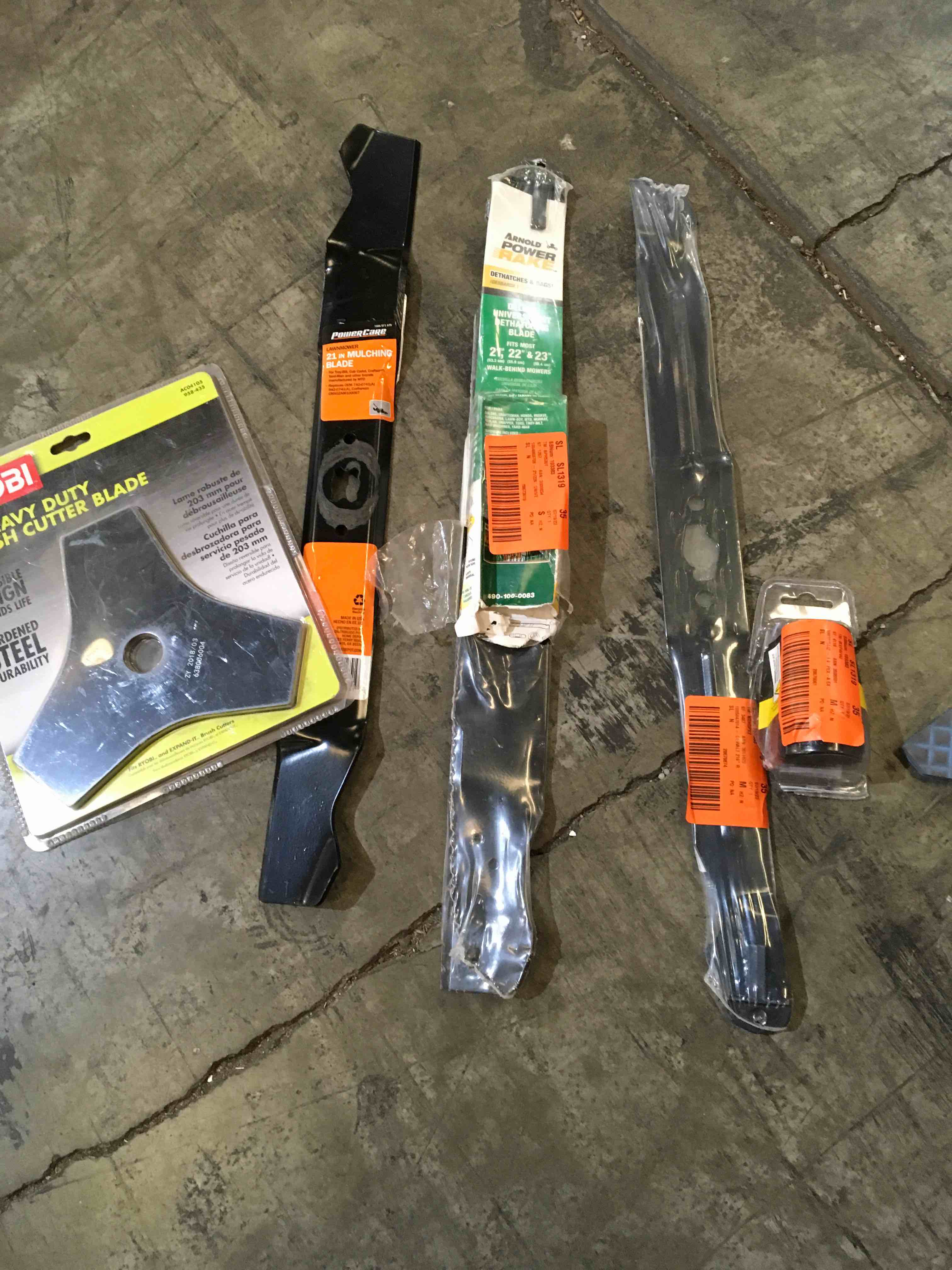 Assorted Lawn Care items. Replacement heads weed eaters and mower blades etc.