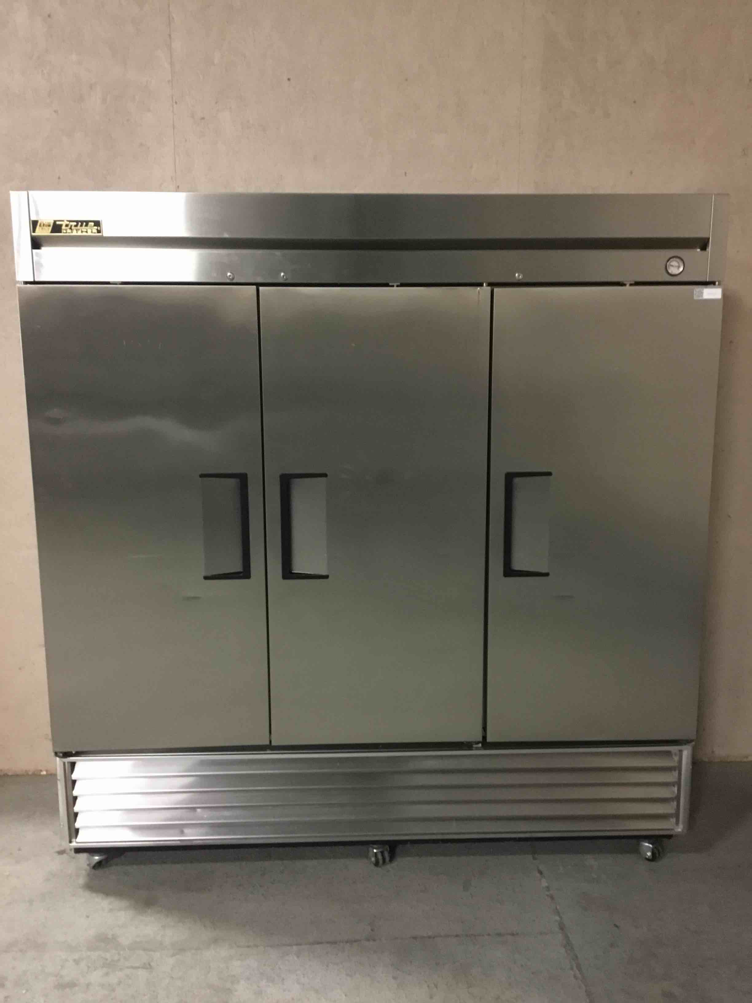 TRUE 77 INCH STAINLESS STEEL 3 DOOR REACH IN FREEZER ON CASTERS 