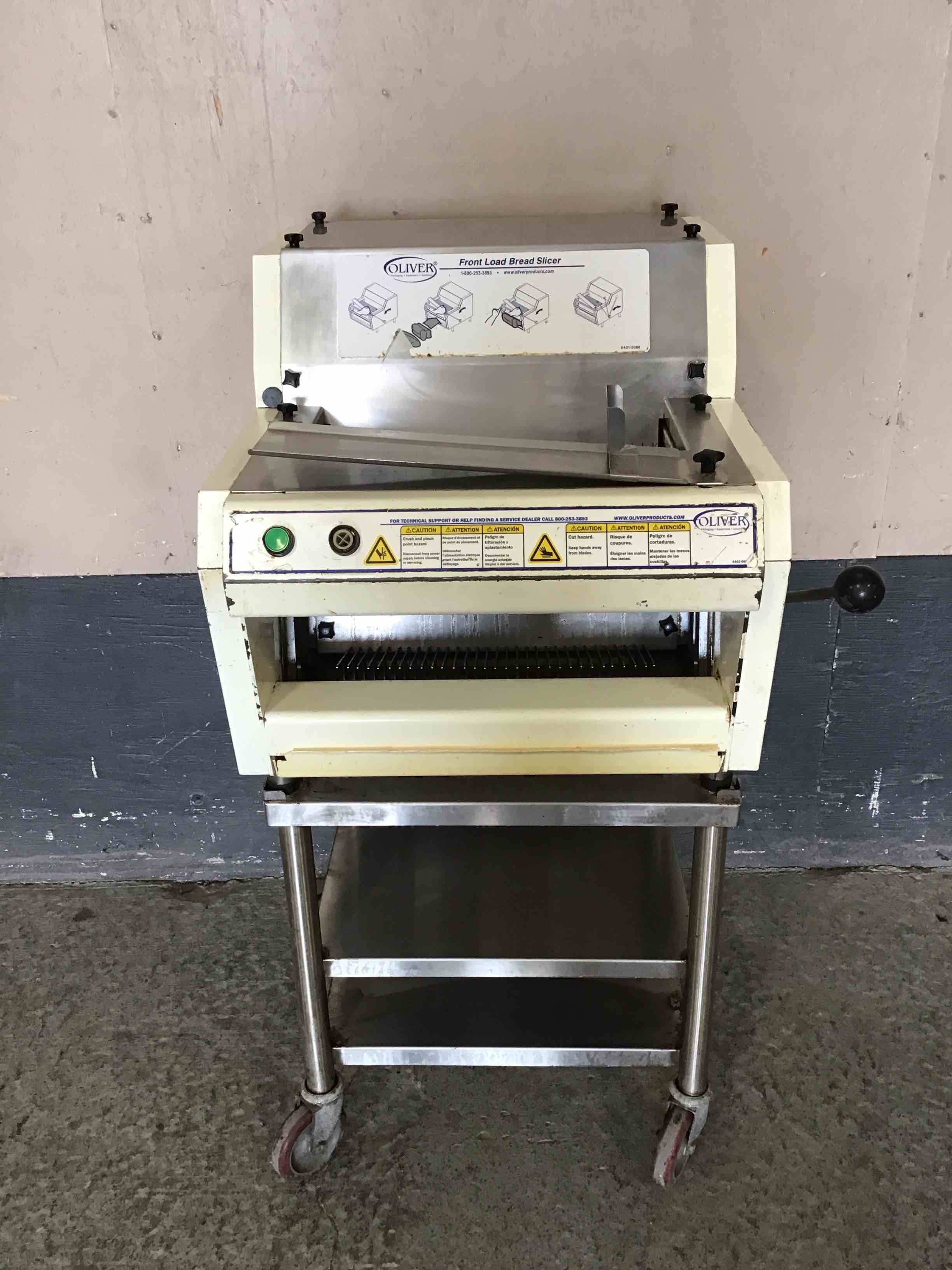 OLIVER FRONT LOAD BREAD SLICER WITH BAGGING SCOOP AND STAINLESS STEEL STAND ON CASTERS
