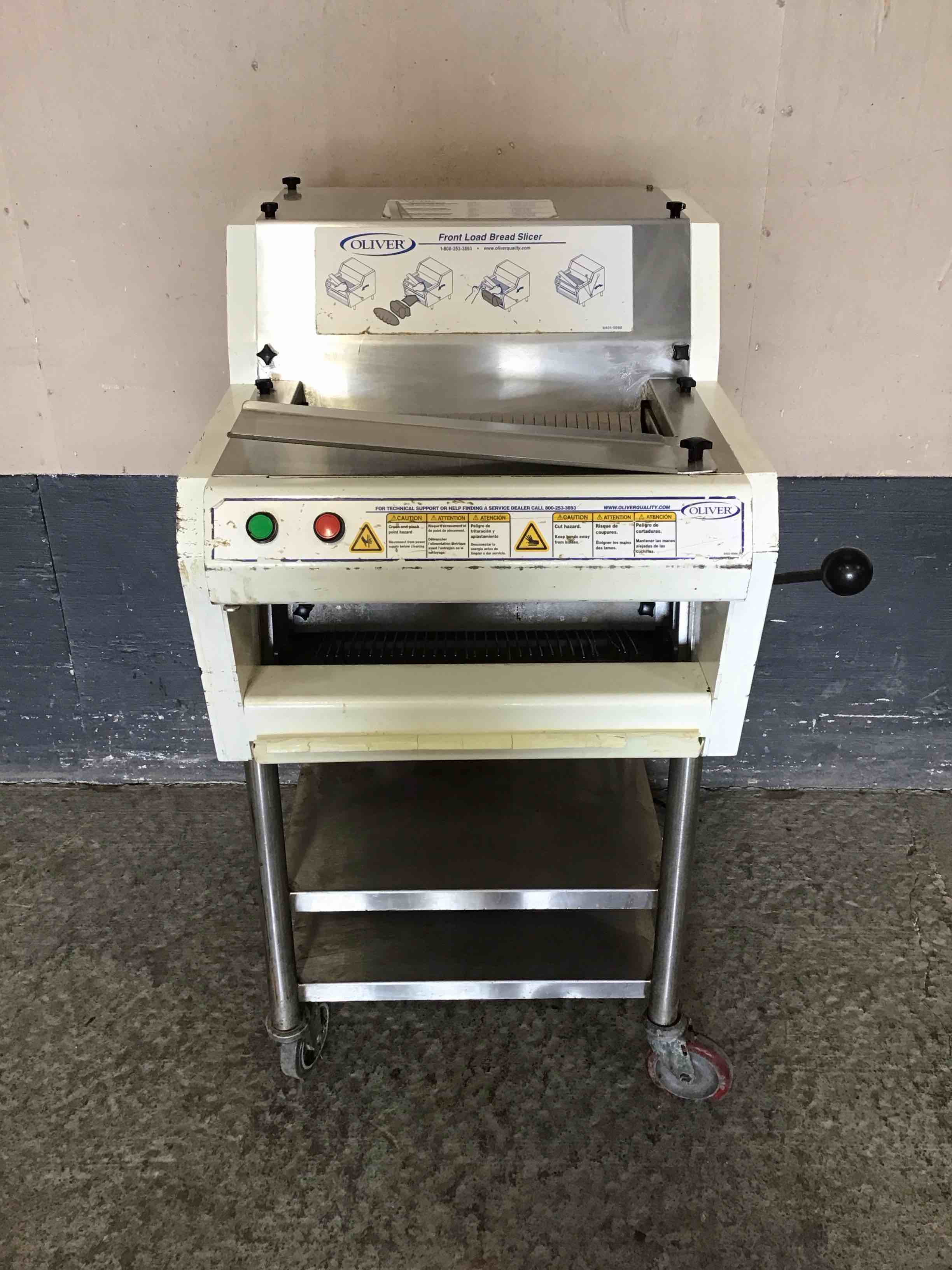 OLIVER FRONT LOAD BREAD SLICER WITH BAGGING SCOOP AND STAINLESS STEEL STAND ON CASTERS