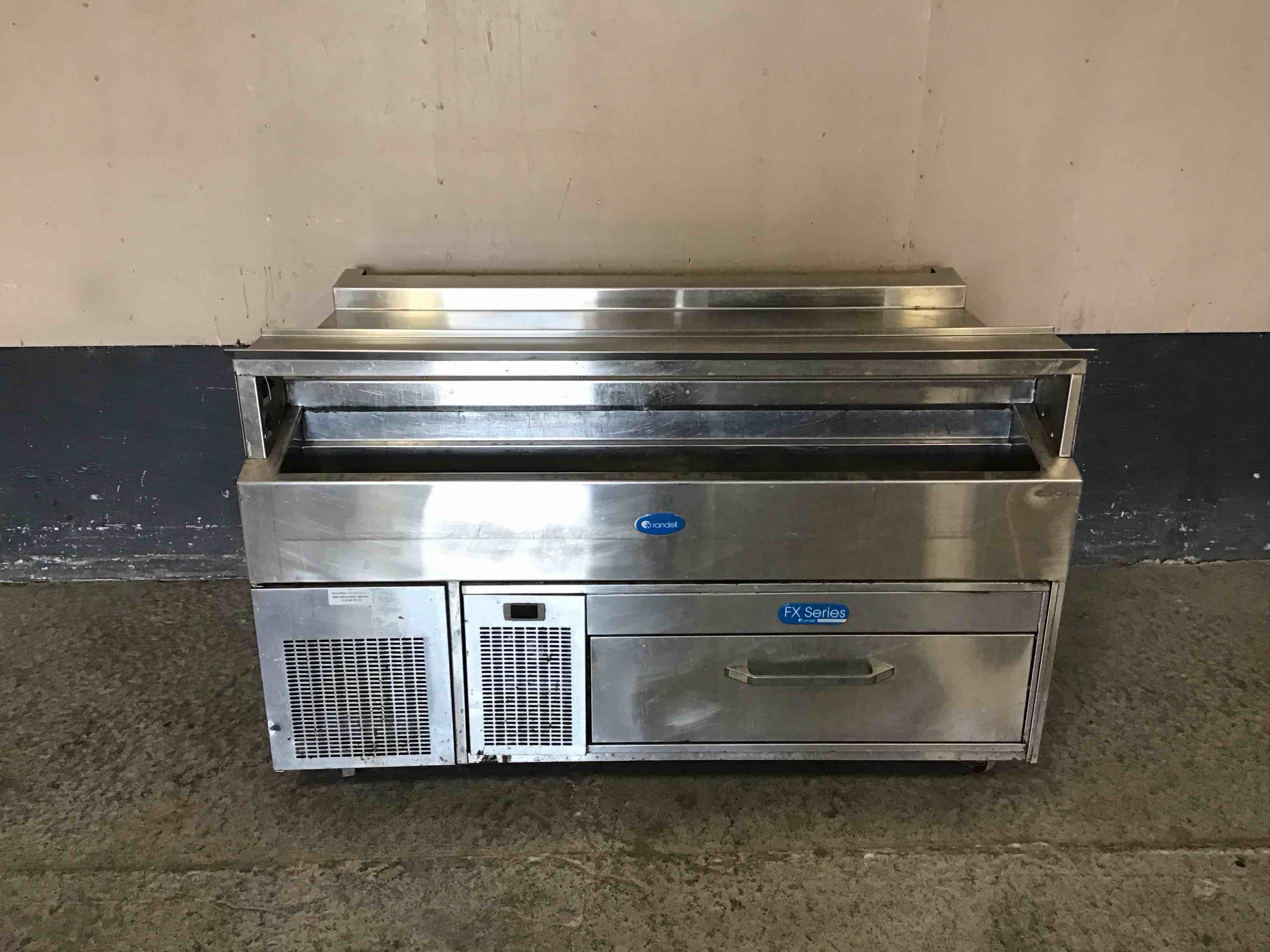 60 INCH STAINLESS STEEL EQUIPMENT STAND PLUS HEATED SHELF, SINGLE DRAWER UNDER FRIDGE, AND COLD RAIL PREP TABLE ON CASTERS