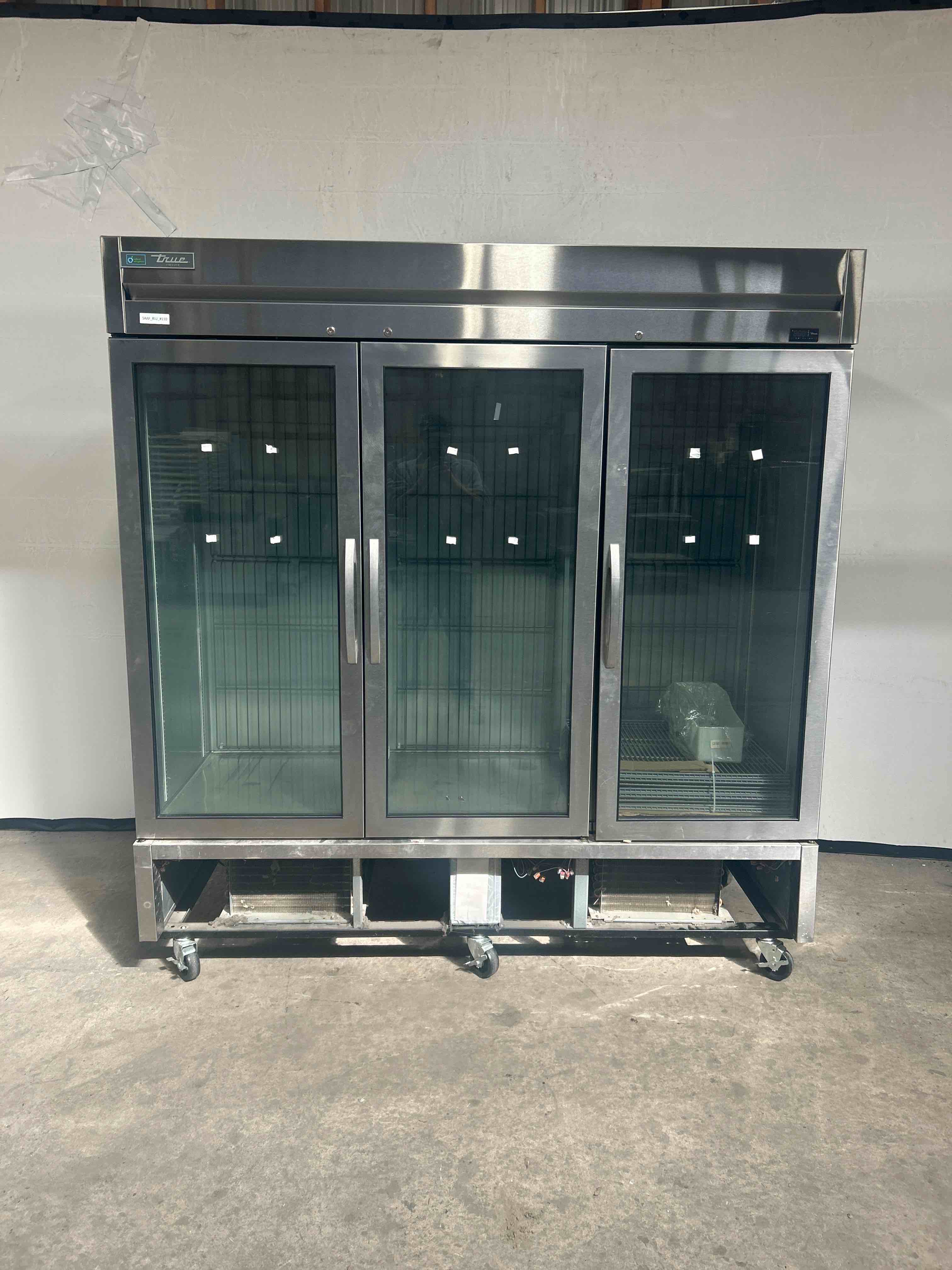2020 TRUE TRIPLE GLASS DOOR FREEZER ON CASTERS