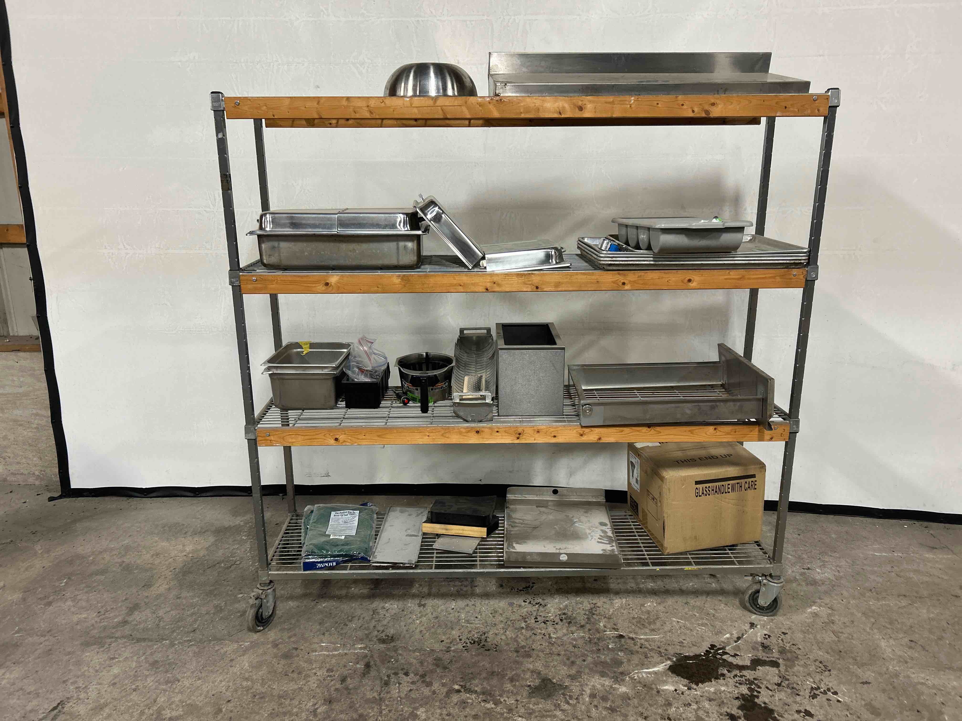 72x19x67 INCH 4 TIER RACK WITH CONTENTS ON CASTERS