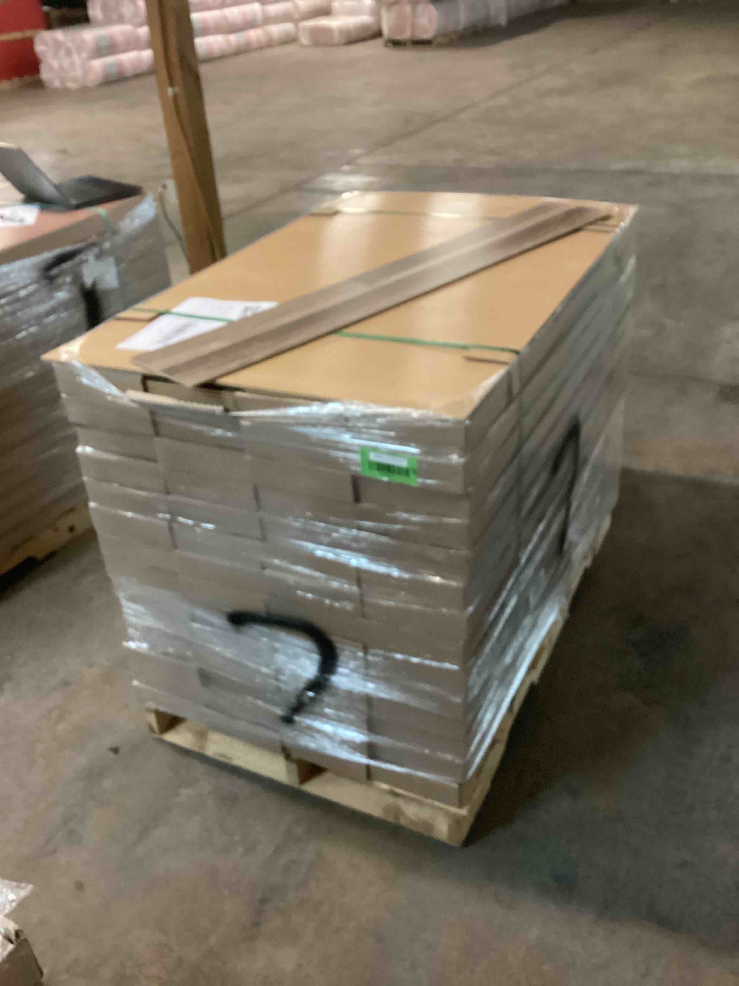 Pallet Of Light Grey/Brown Wood Grain Laminate Flooring 7 Millimeter Thick 1340 Square Foot