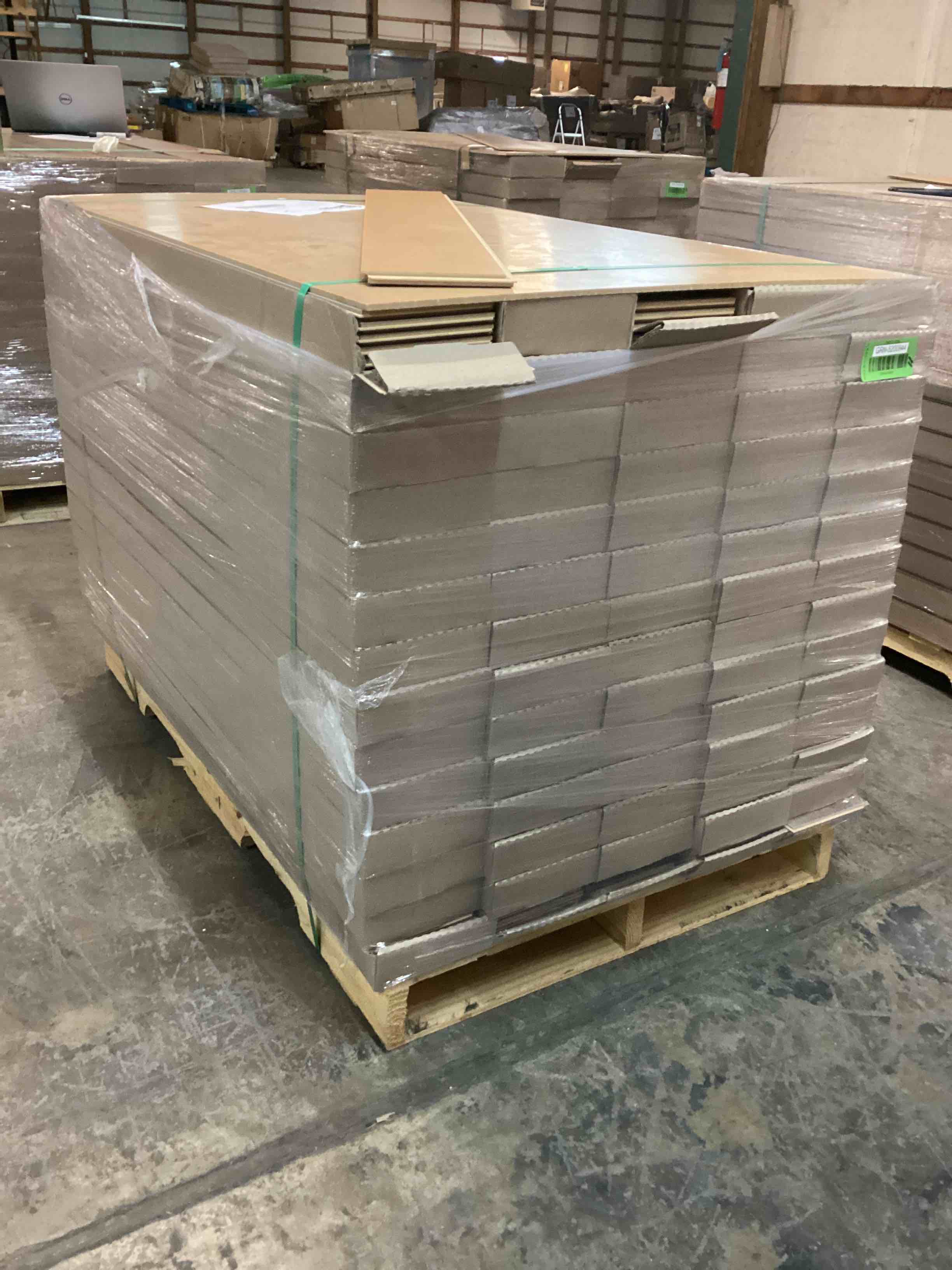 Pallet of Forrest Grey WoodGrain color 12 Millimeter Thick Laminate Flooring 735 Total Square Feet