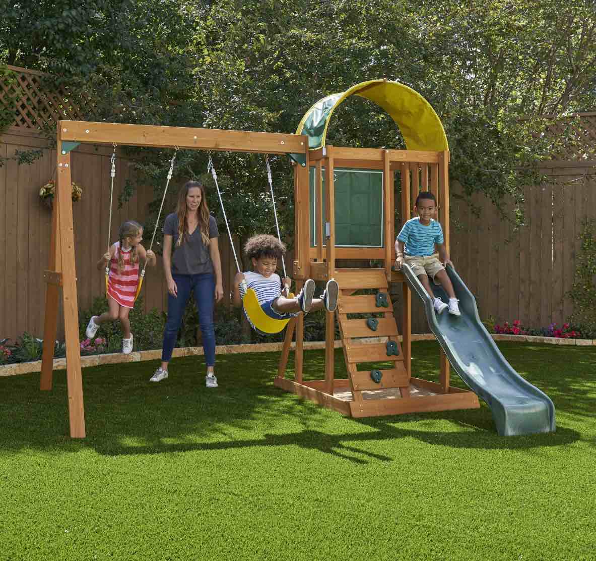 KidKraft Ainsley Wooden Outdoor Swing Set with Slide and Rock Wall