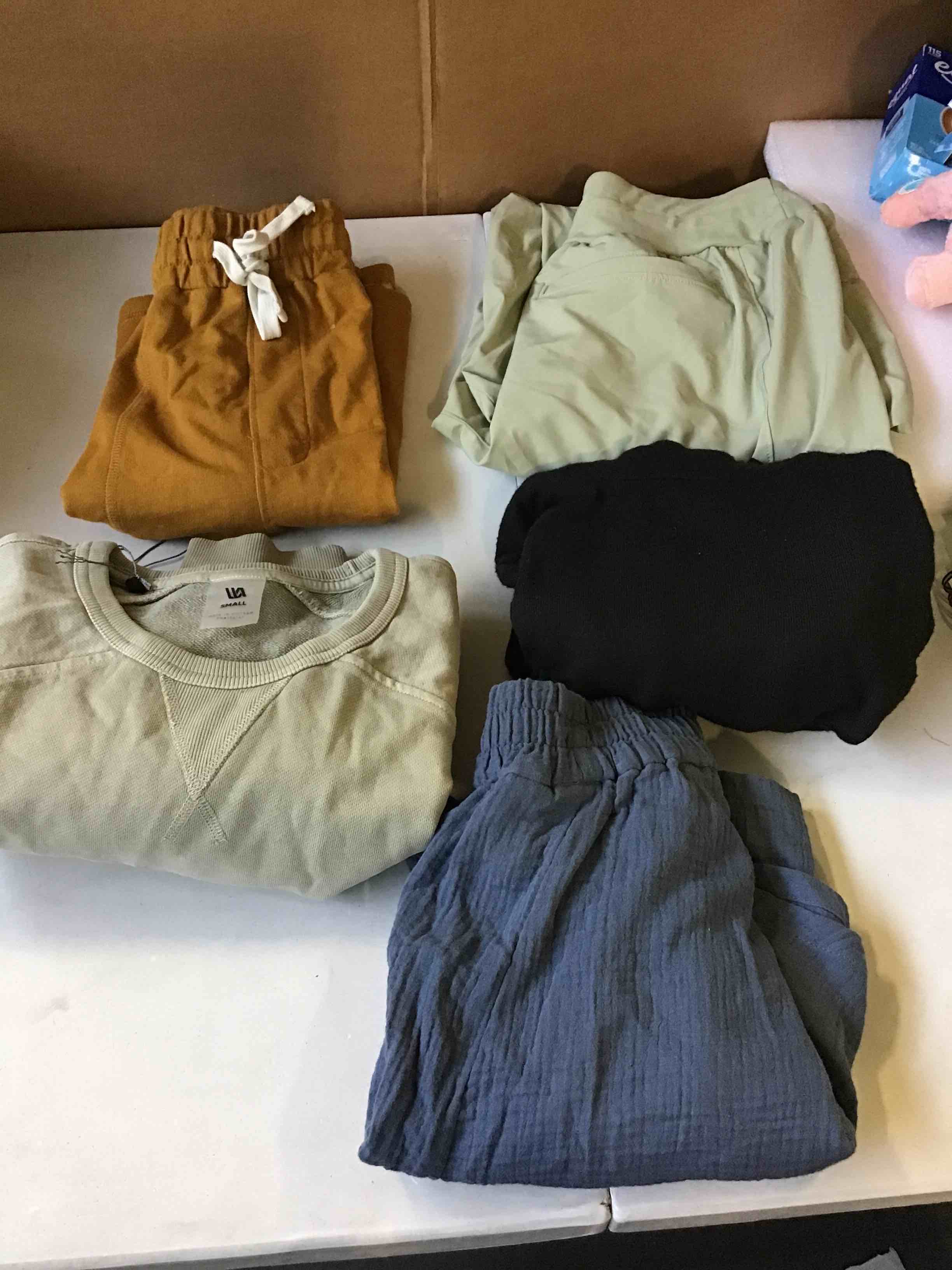 Assorted clothes sizes, colors, brands