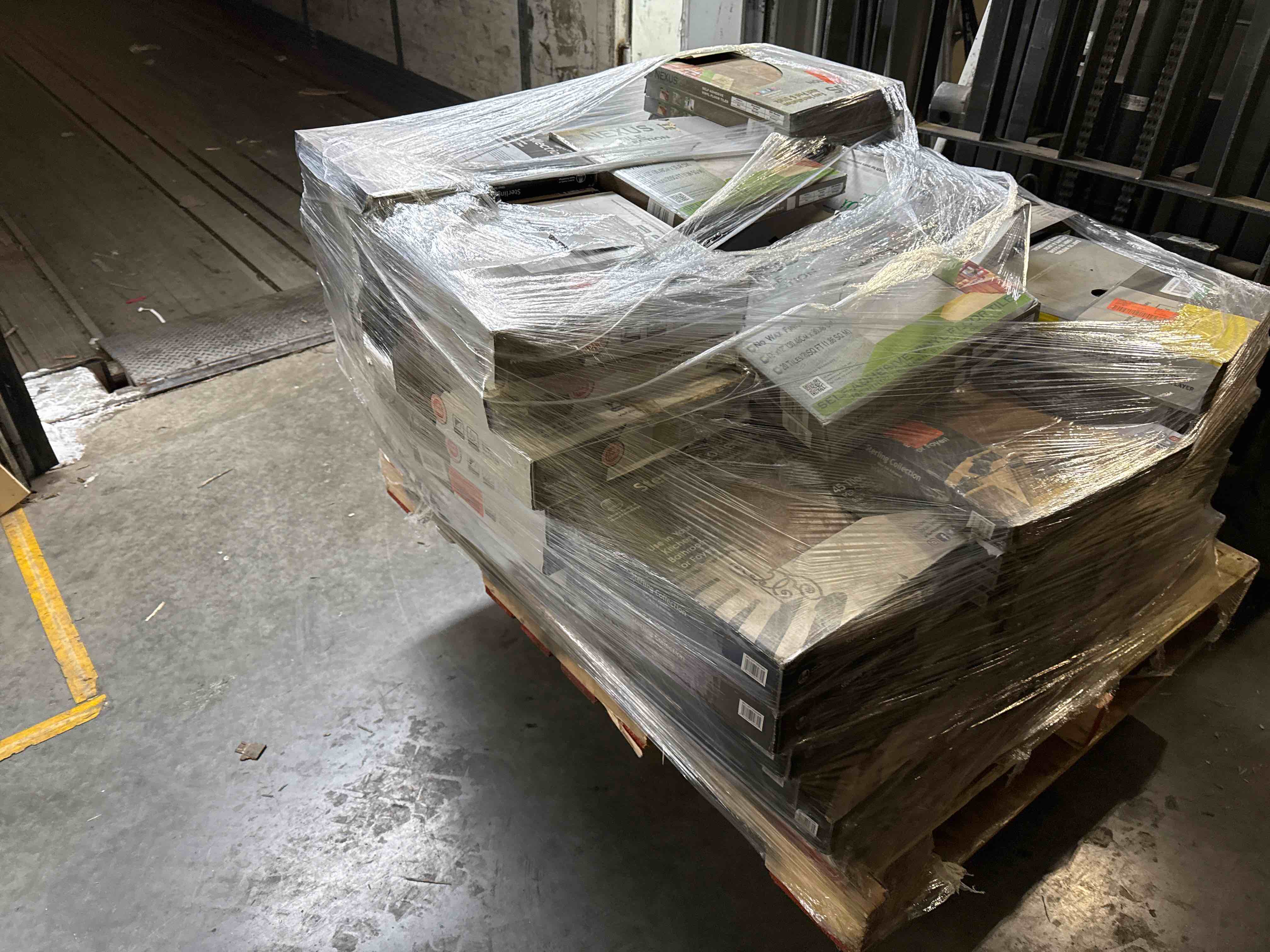 skid lot of assorted flooring most is peel and stick