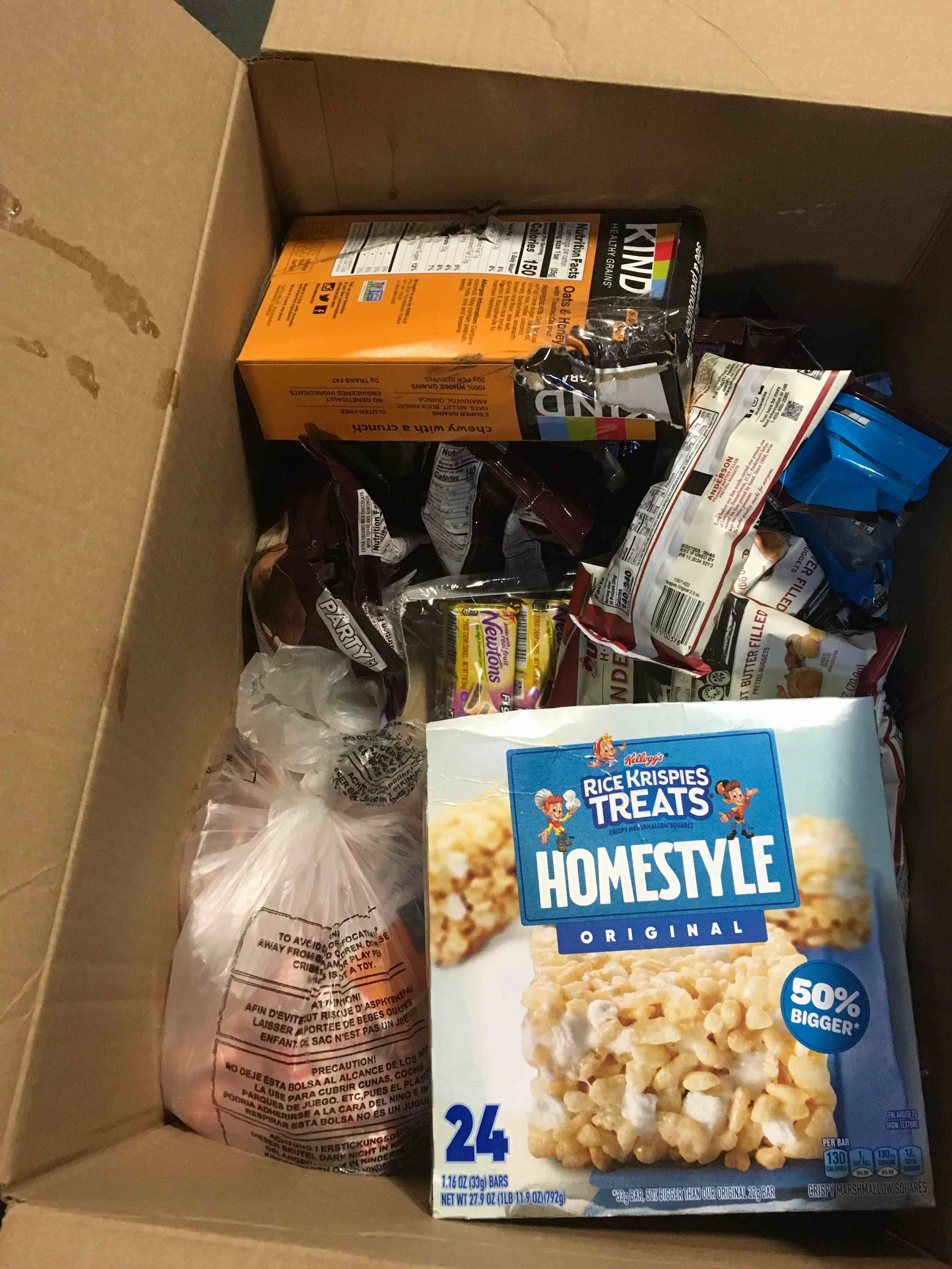 box of Assorted food items, including kind bars, rice, crispy treats