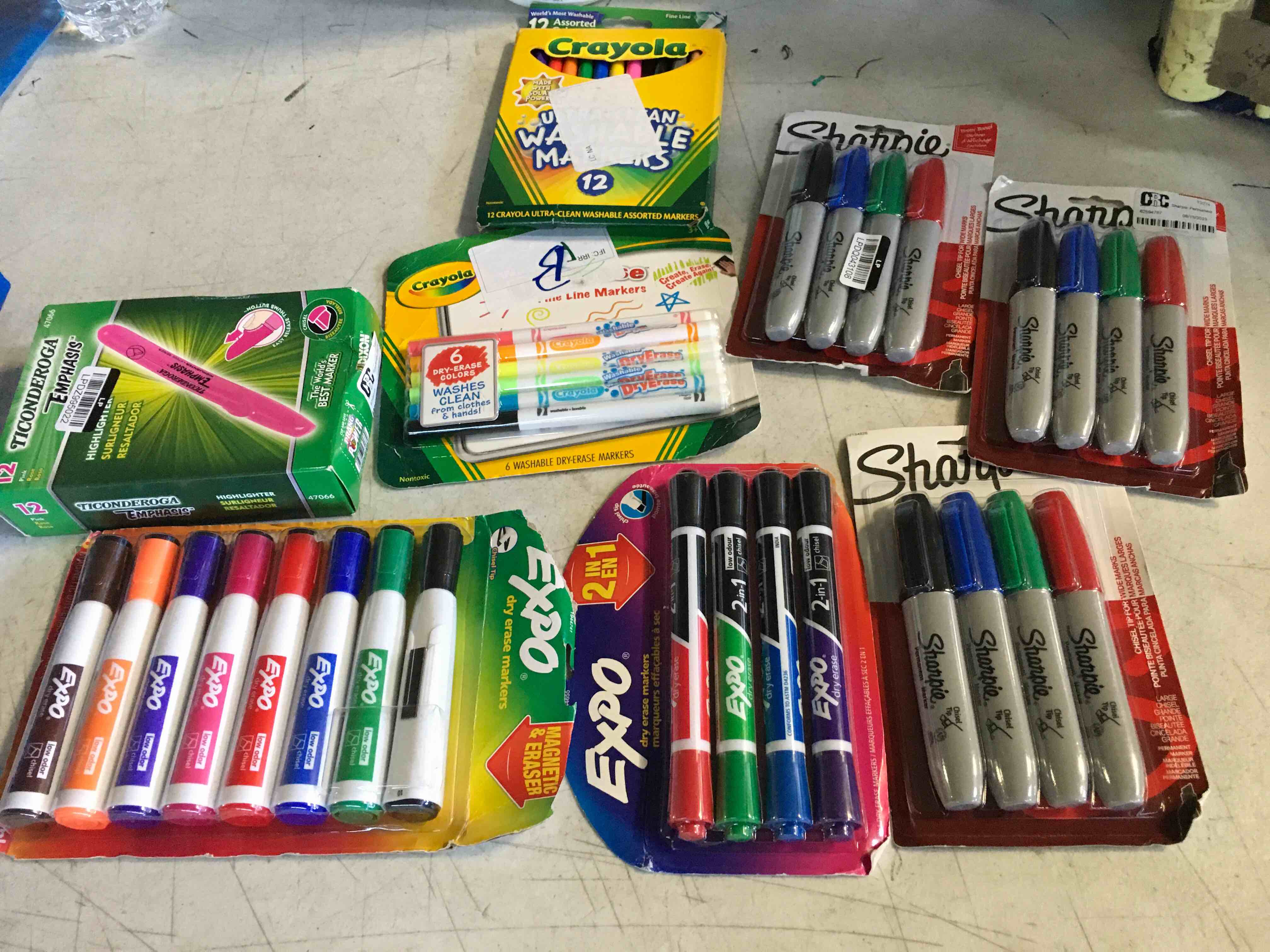 Assorted of pencil cases and markers