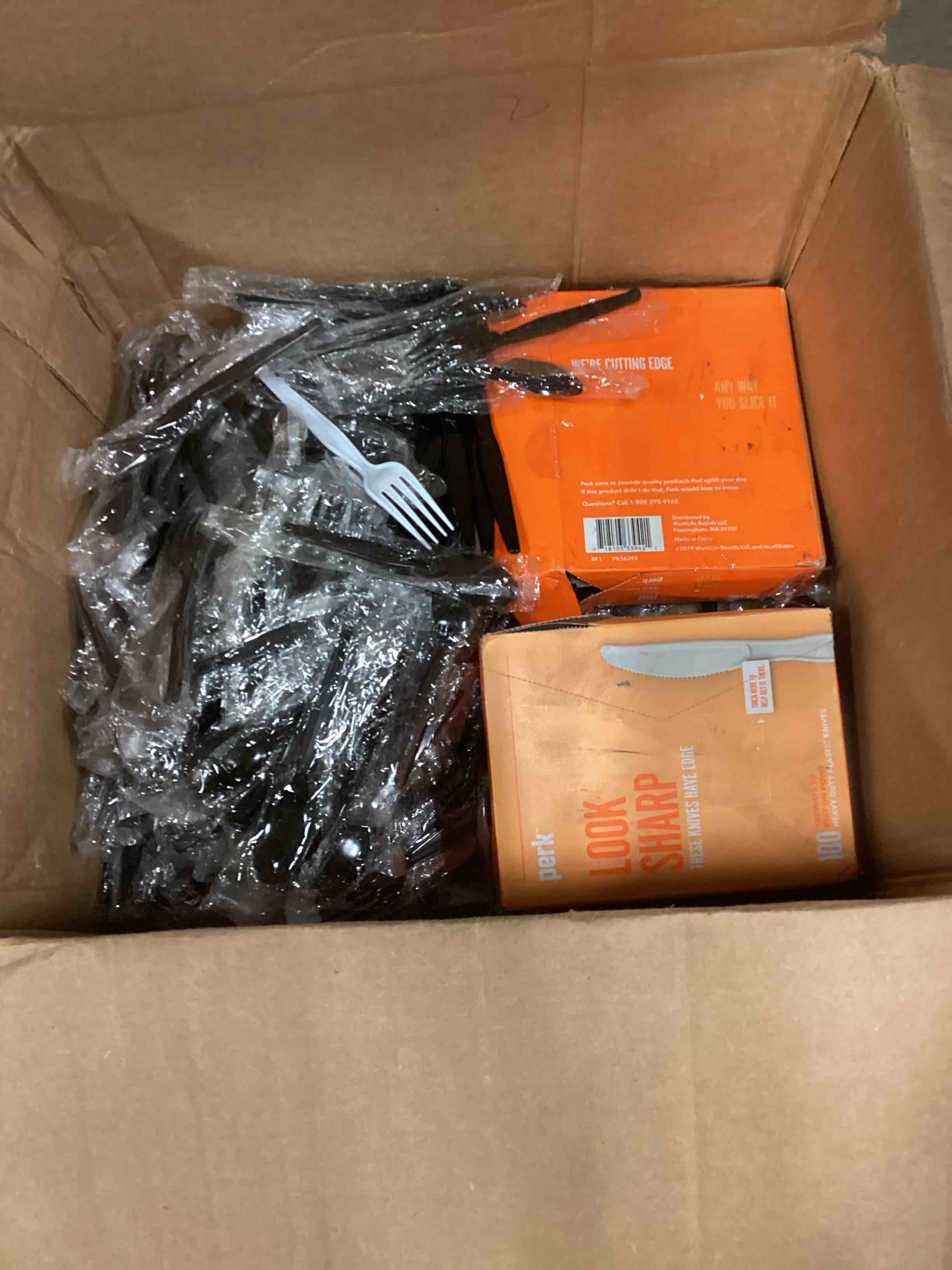 Assorted items of spoons knives forks .