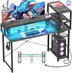 Cyclysio Gaming Desk 47" Computer Desk with Reversible Storage Shelves Home Office Desk with Power Outlets RGB Led Lights for Gaming, Studying, Working Black