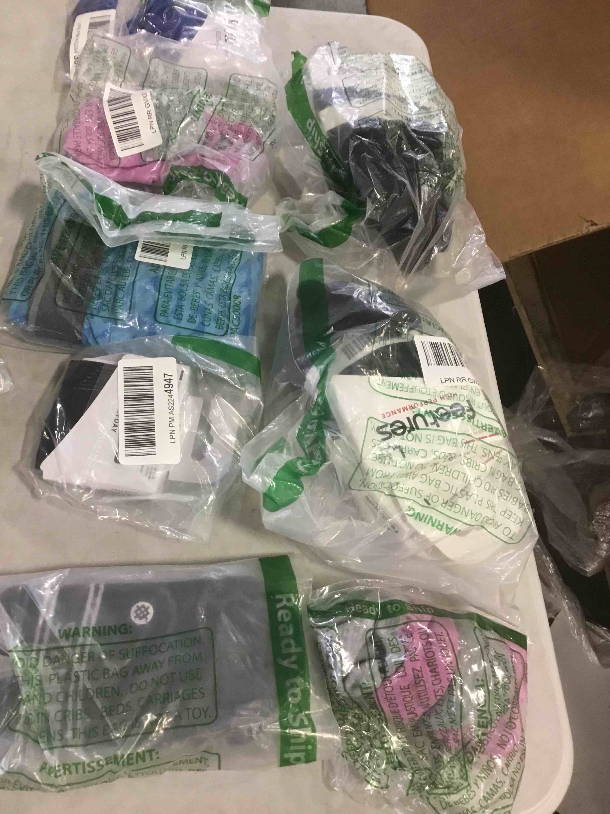 assorted socks and insoles varying in sizes and styles