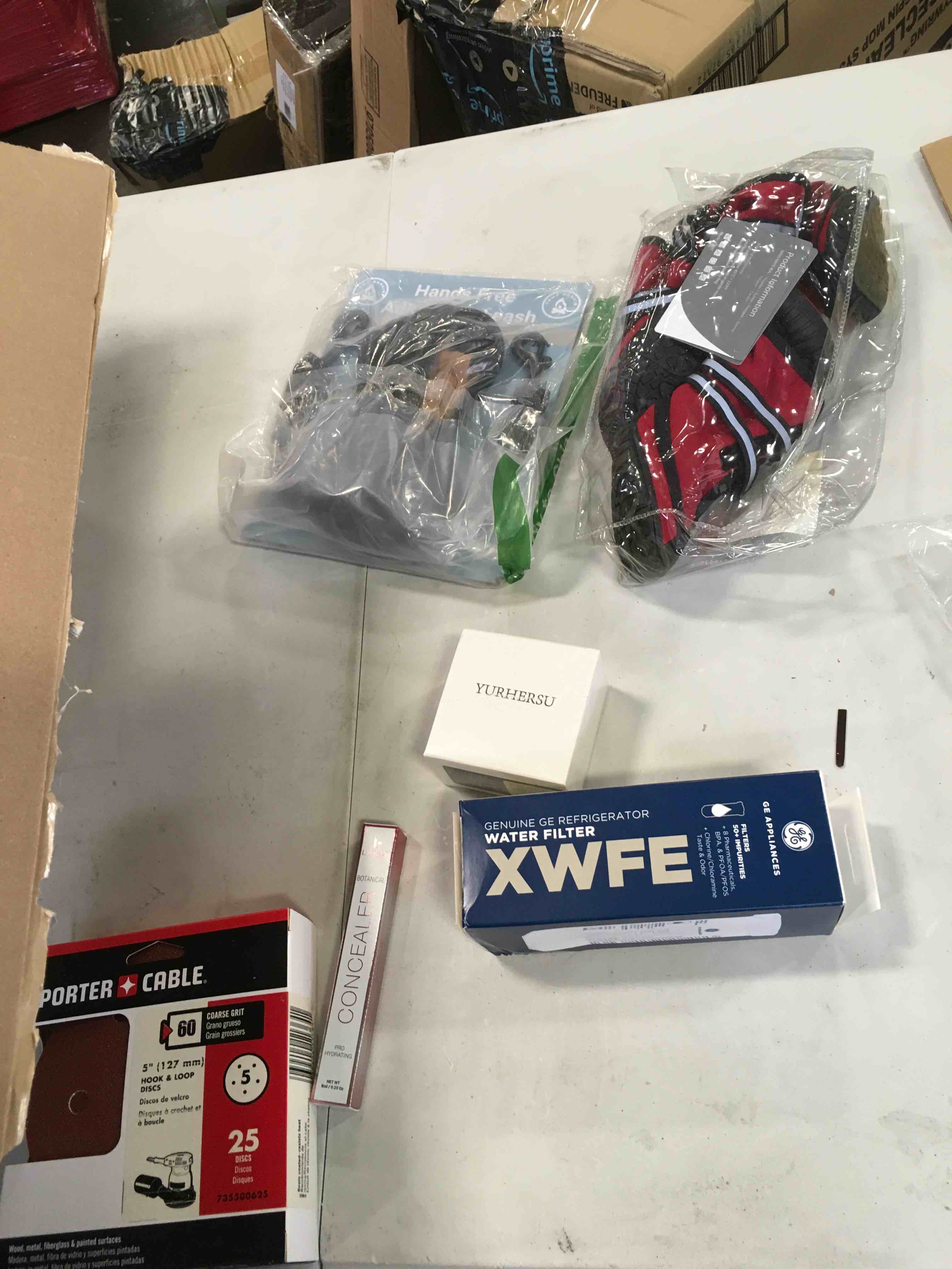 case pack assorted items dog shoes, hook and loop coarse grit pads,face cream , dog leash water filter and more 