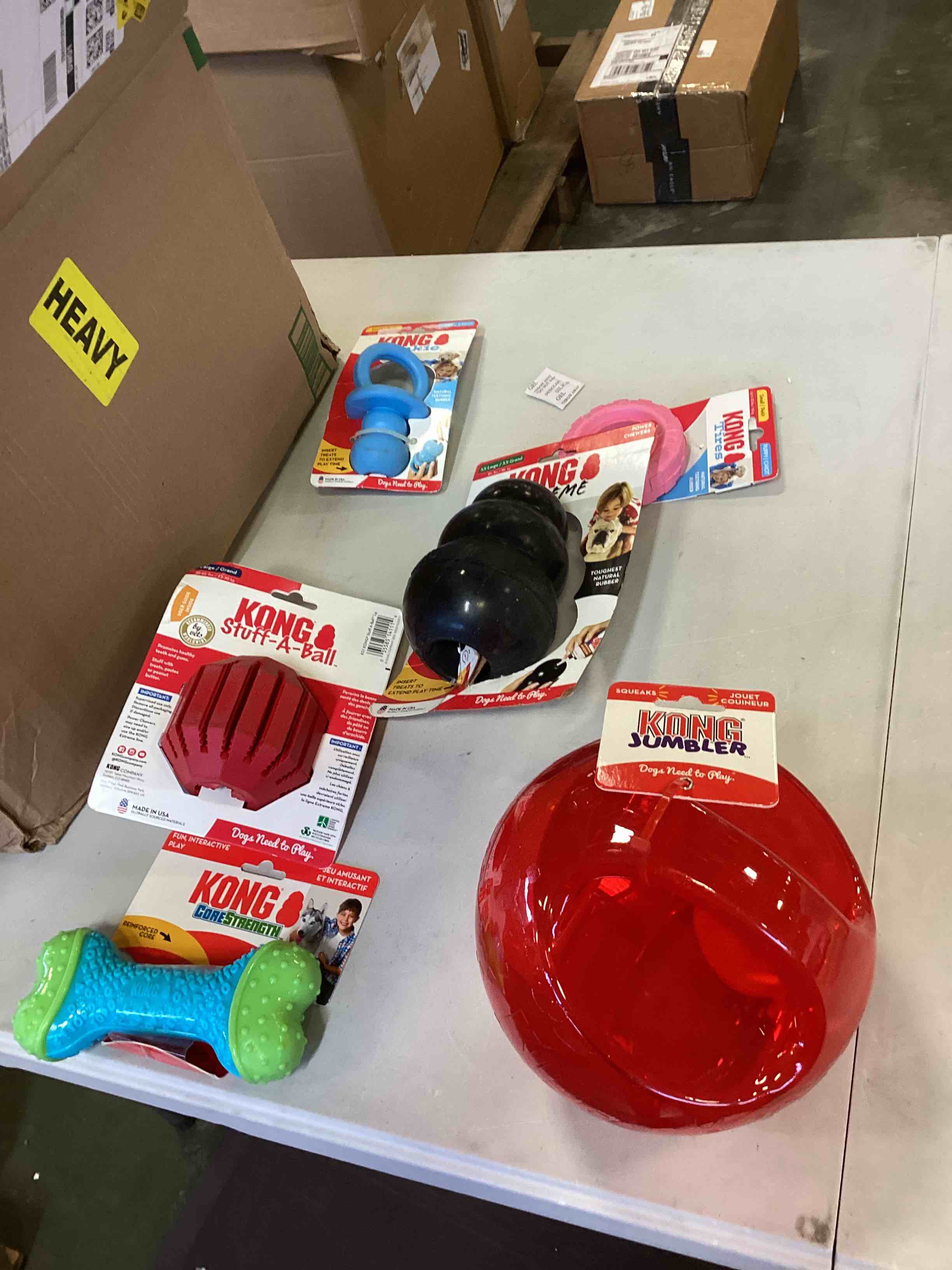 case pack assorted Kong dog chew toy inclues Kong binkie, Kong tire, Kong extreme Kong jumbler,Kong stuff a ball and more 