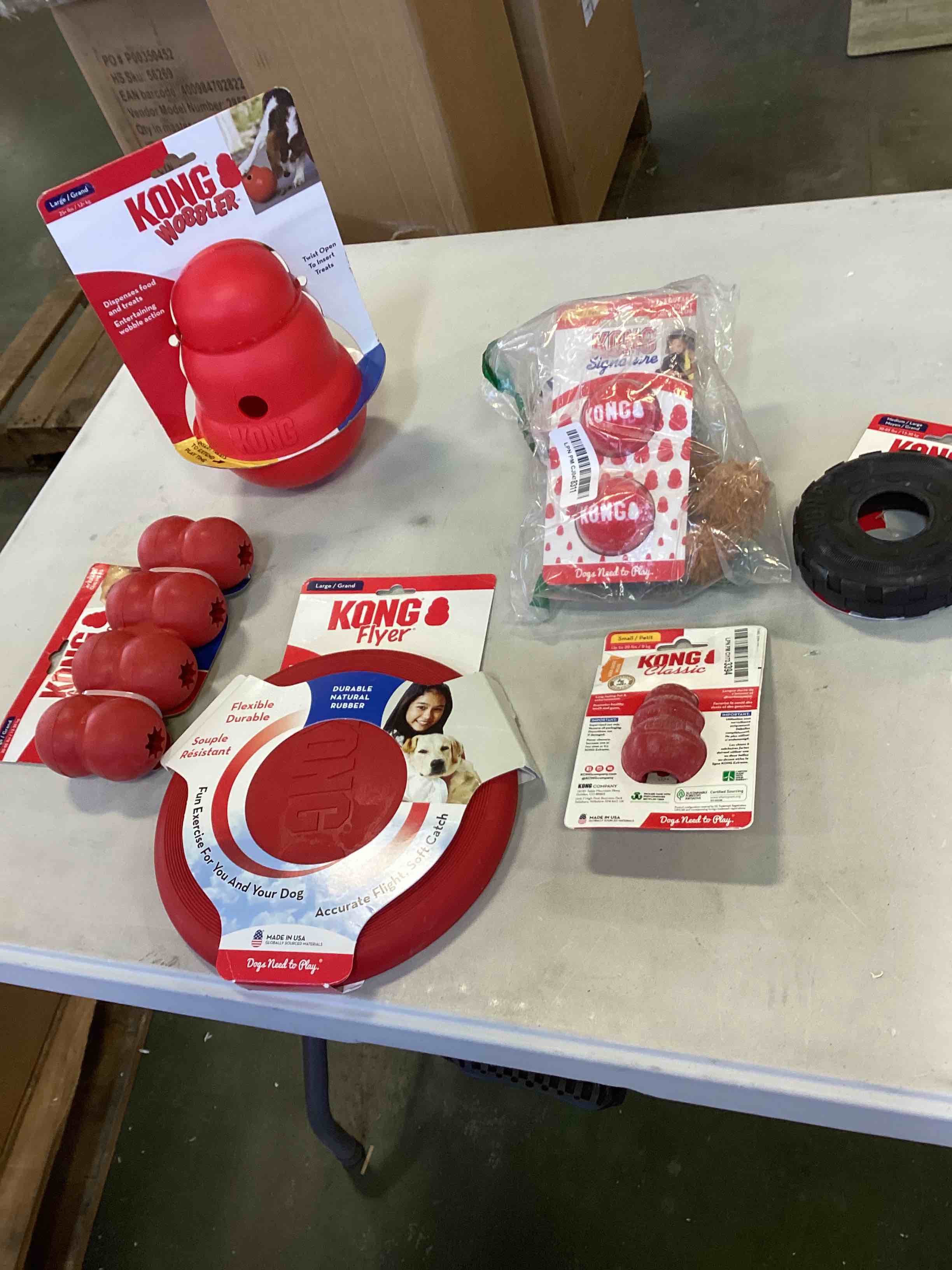 assorted Kong dog toys include KONG FLYER, GOODIE RIBBON,KONG CLASSIC,KONG TIRE,LARGE KONG WOBBLER SMALL KONG SIGNATURE AND MORE 