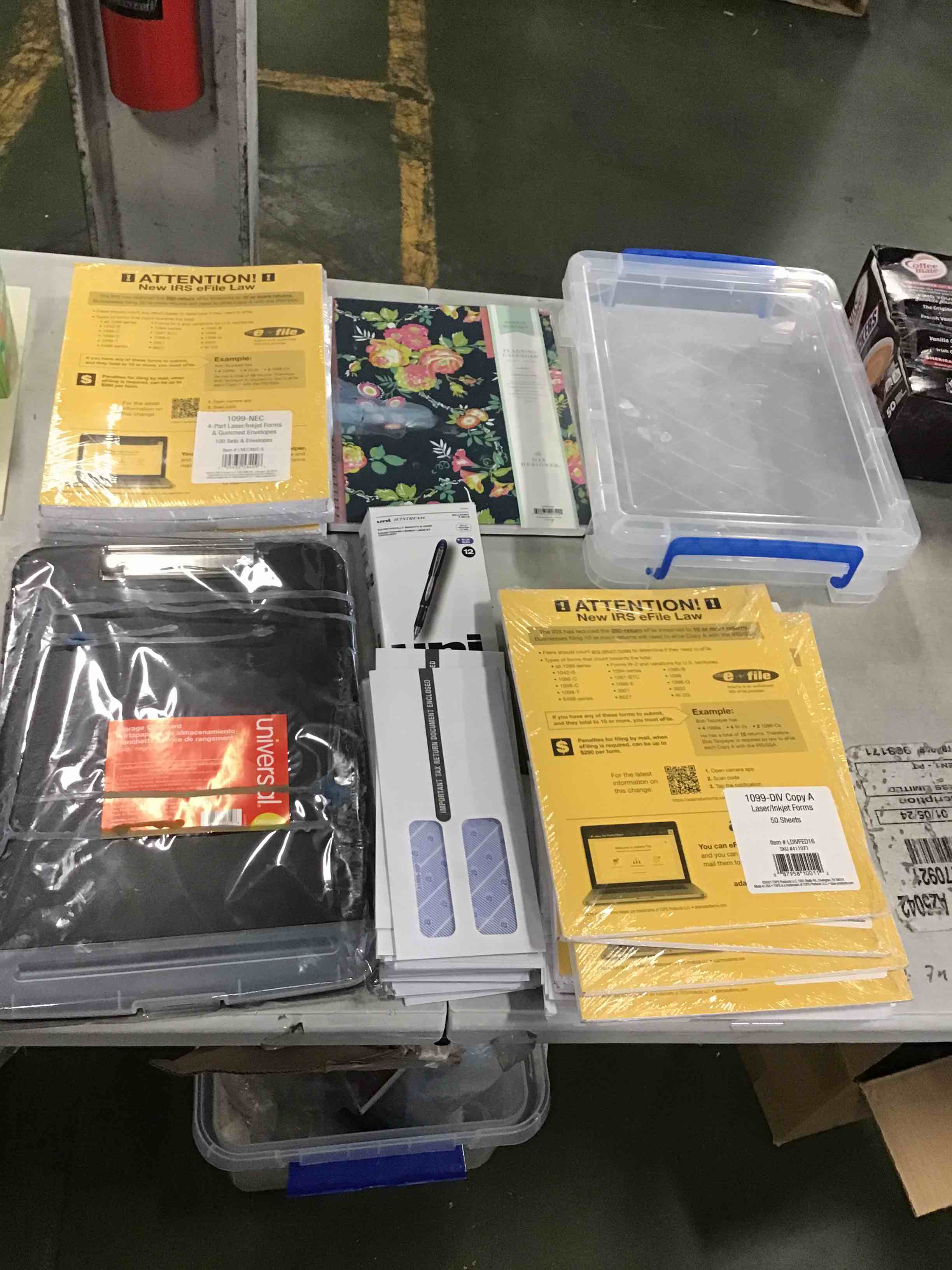 assorted office supplies including planner, storage clip board, pens and more 