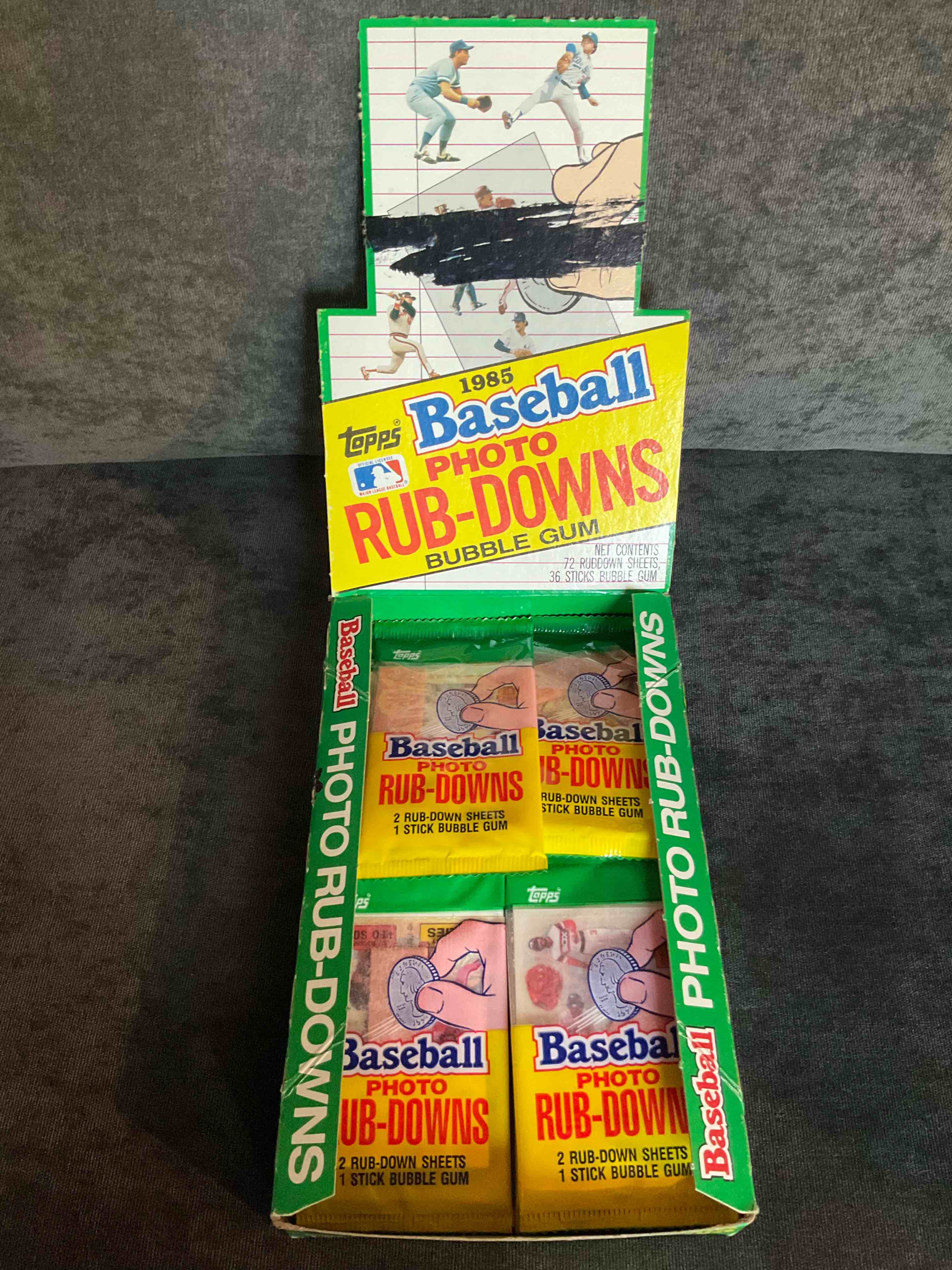1985 Rare Baseball History! Search For You Favorite Vintage Team & Stars With These Sealed 1985 Baseball Rub-Down Graphic Card Packs, Direct From The Original Retail Case! Each Pack Contains Two Rub-Down Cards That When Scribbled Over Produce Super Cool Baseball Team & Player Graphics On Multiple Services. Rare Baseball History... Which Team & Players Will You Get? This 1985 Set Is Chock Full Of Hall Of Fame Players, There's A Good Chance You Will Get A Hall Of Famer If You Win This Auction!