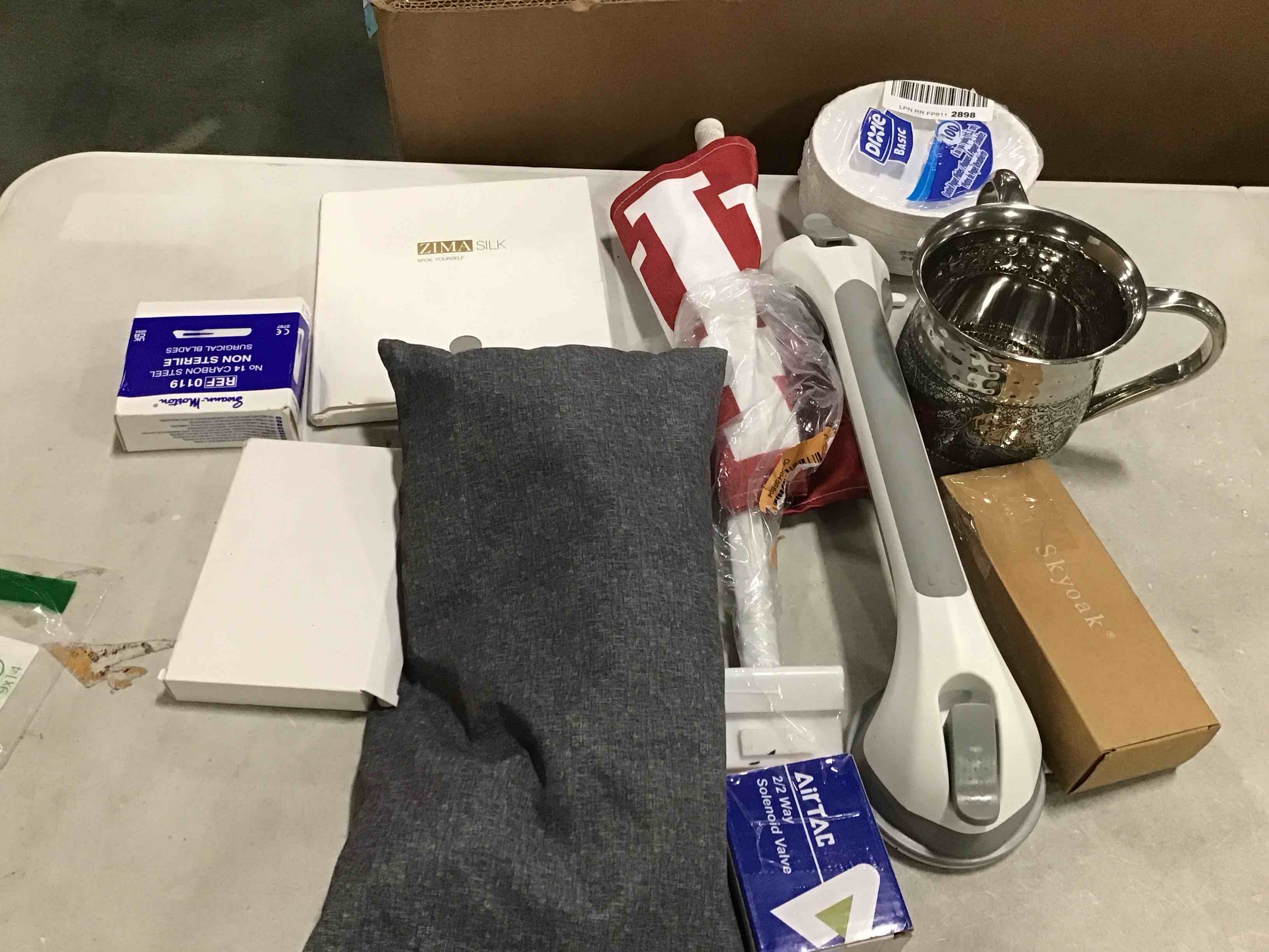 10 pieces Assorted of different products includes small disposable plates, flag, cushion and more