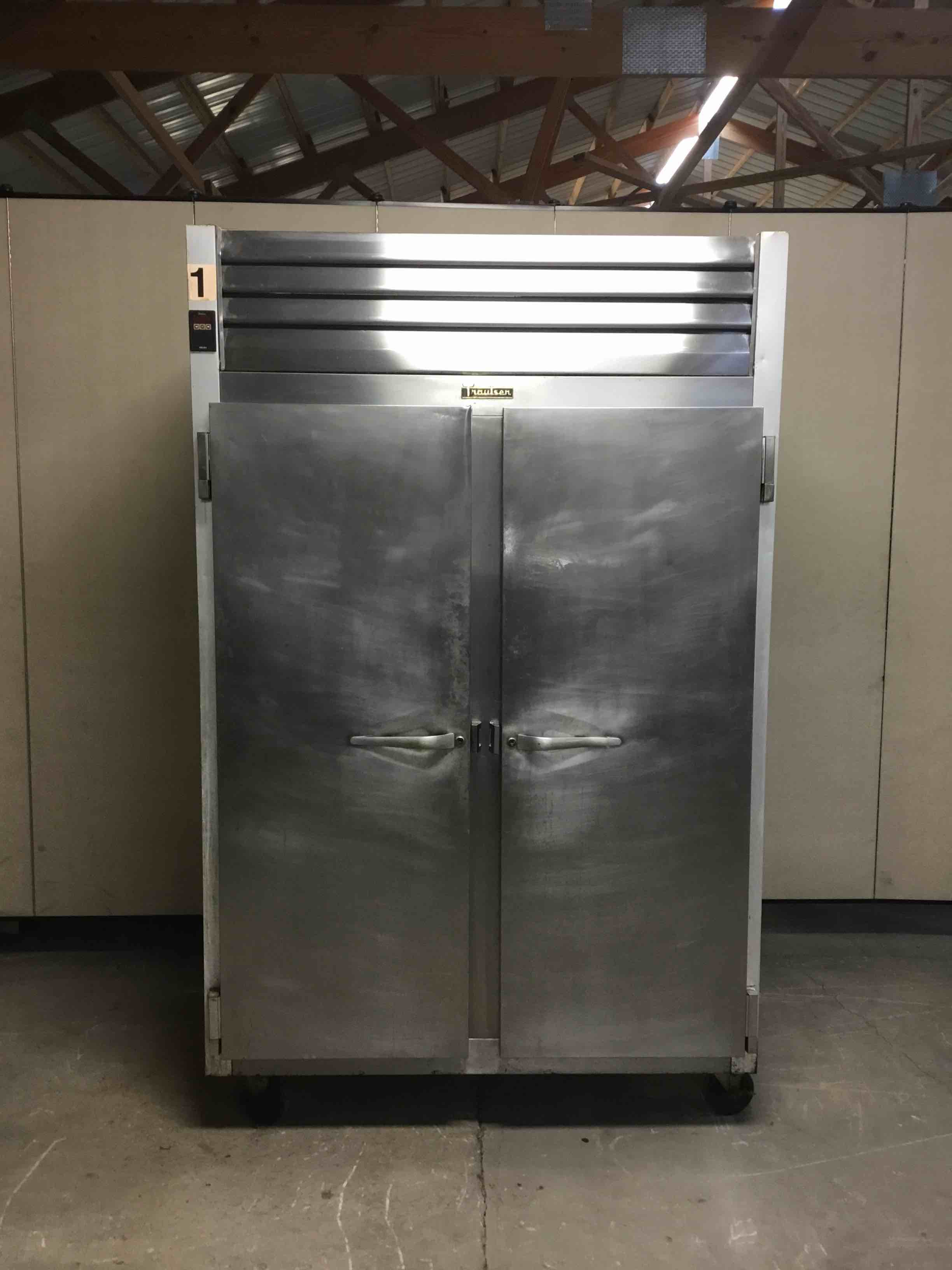 TRAULSEN TWO DOOR STAINLESS STEEL REACH IN FREEZER ON CASTERS