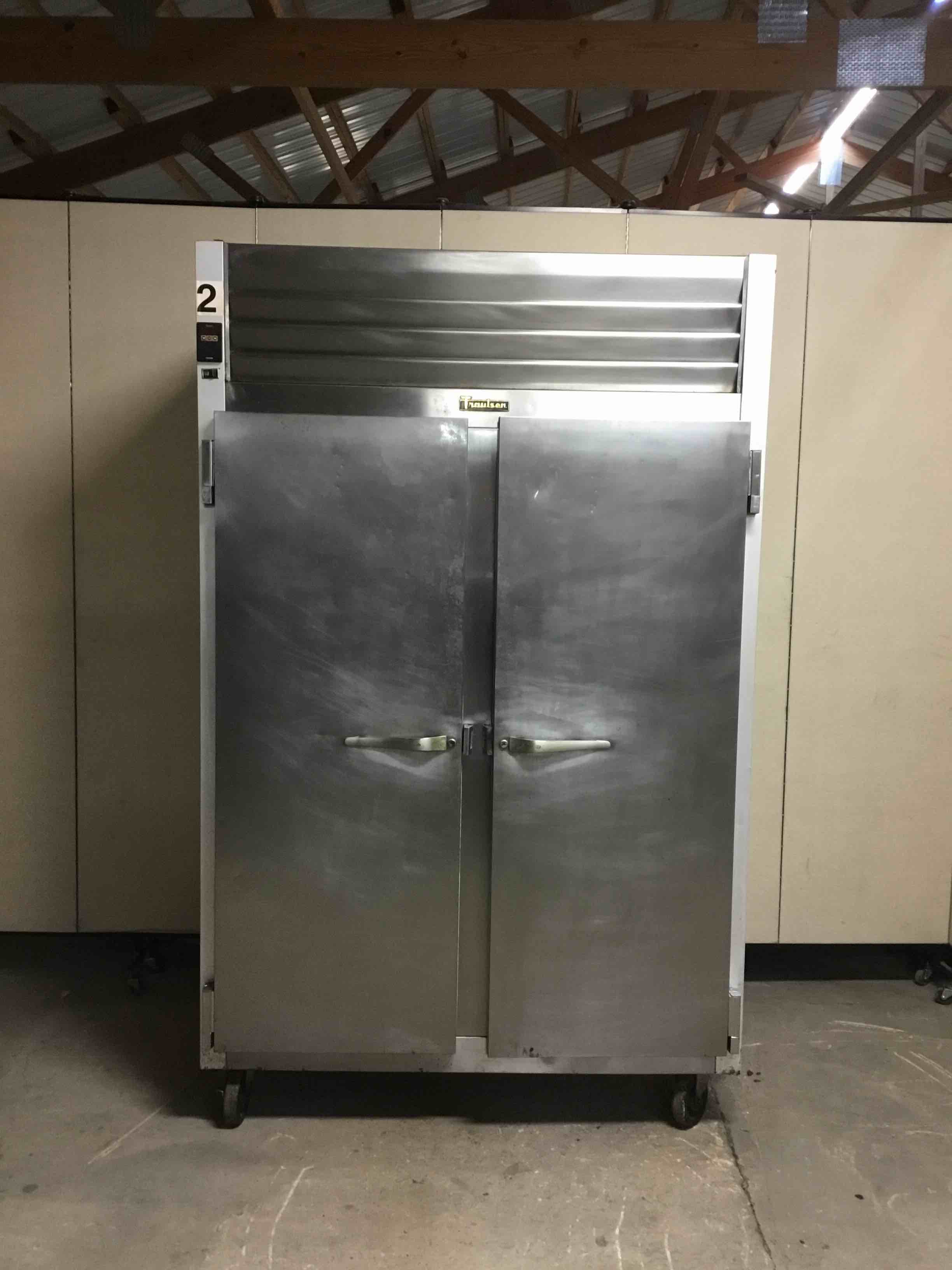 TRAULSEN TWO DOOR STAINLESS STEEL REACH IN FREEZER ON CASTERS