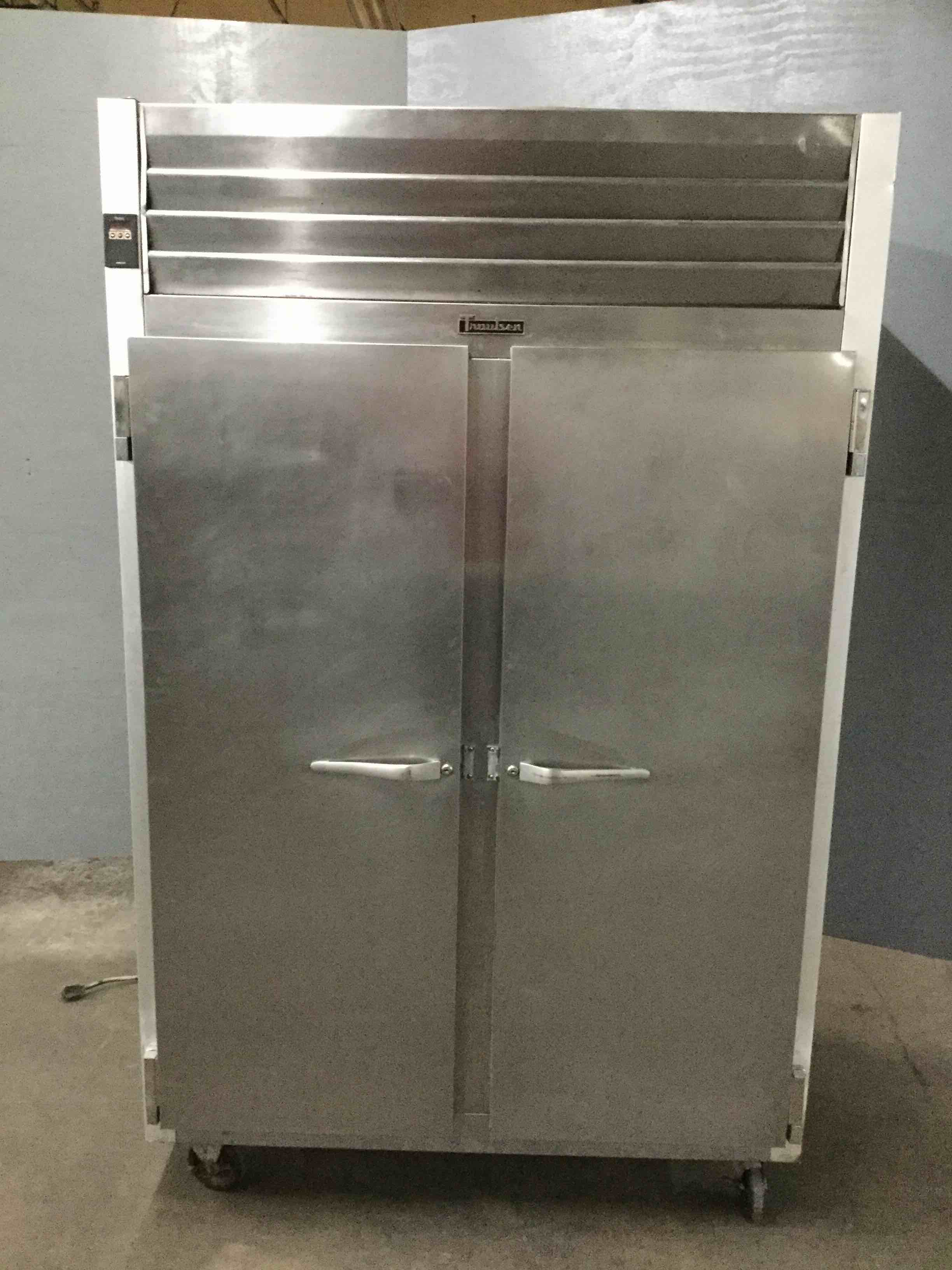 TRAULSEN STAINLESS STEEL REACH IN FREEZER ON CASTERS 