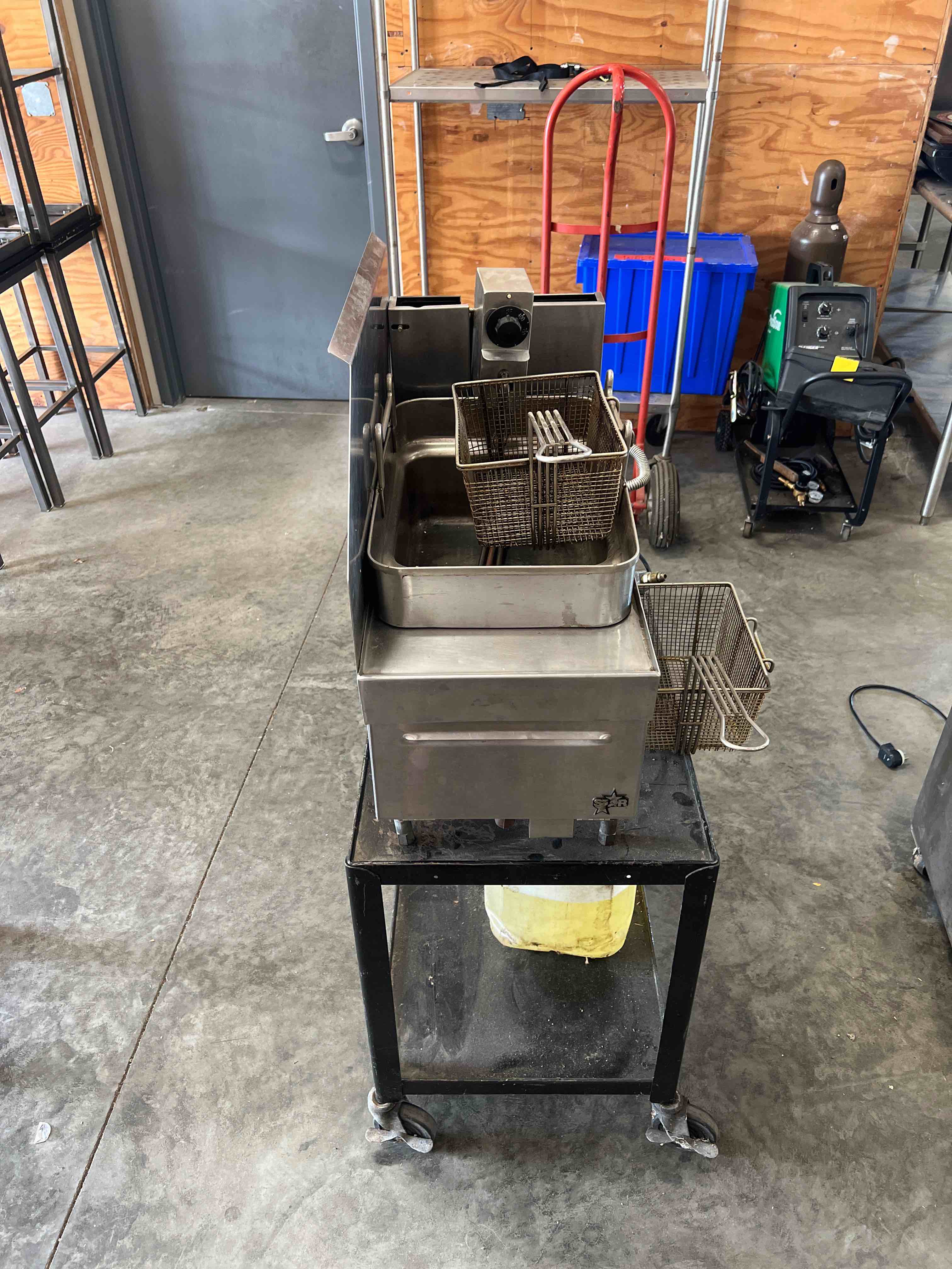 STAR PROPANE DEEP FRYER WITH TWO BASKETS ON EQUIPMENT STAND WITH CASTERS 