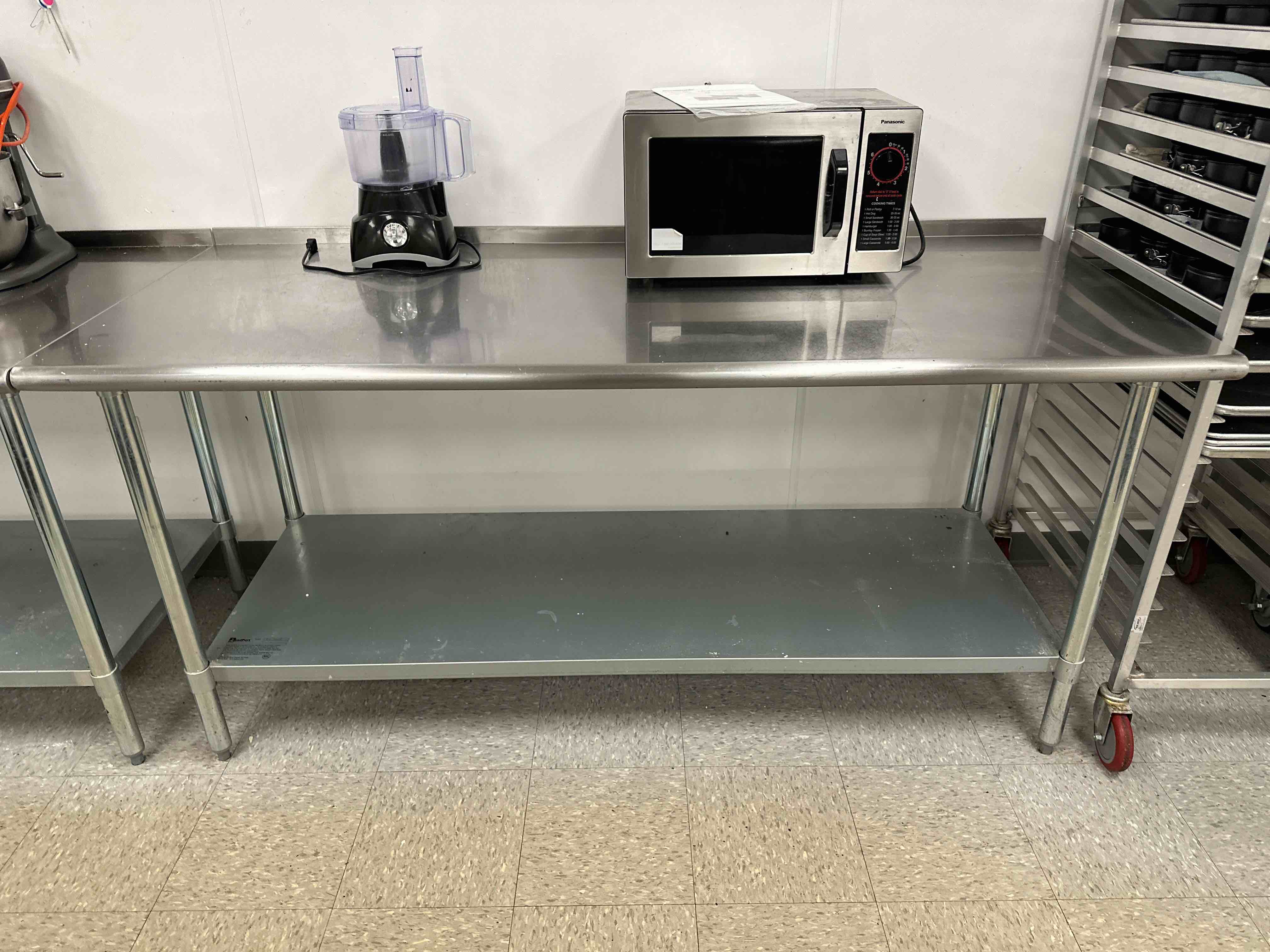 EAGLE BENDPORT STAINLESS STEEL TABLE WITH UNDER SHELF AND ONE INCH BACKSPLASH