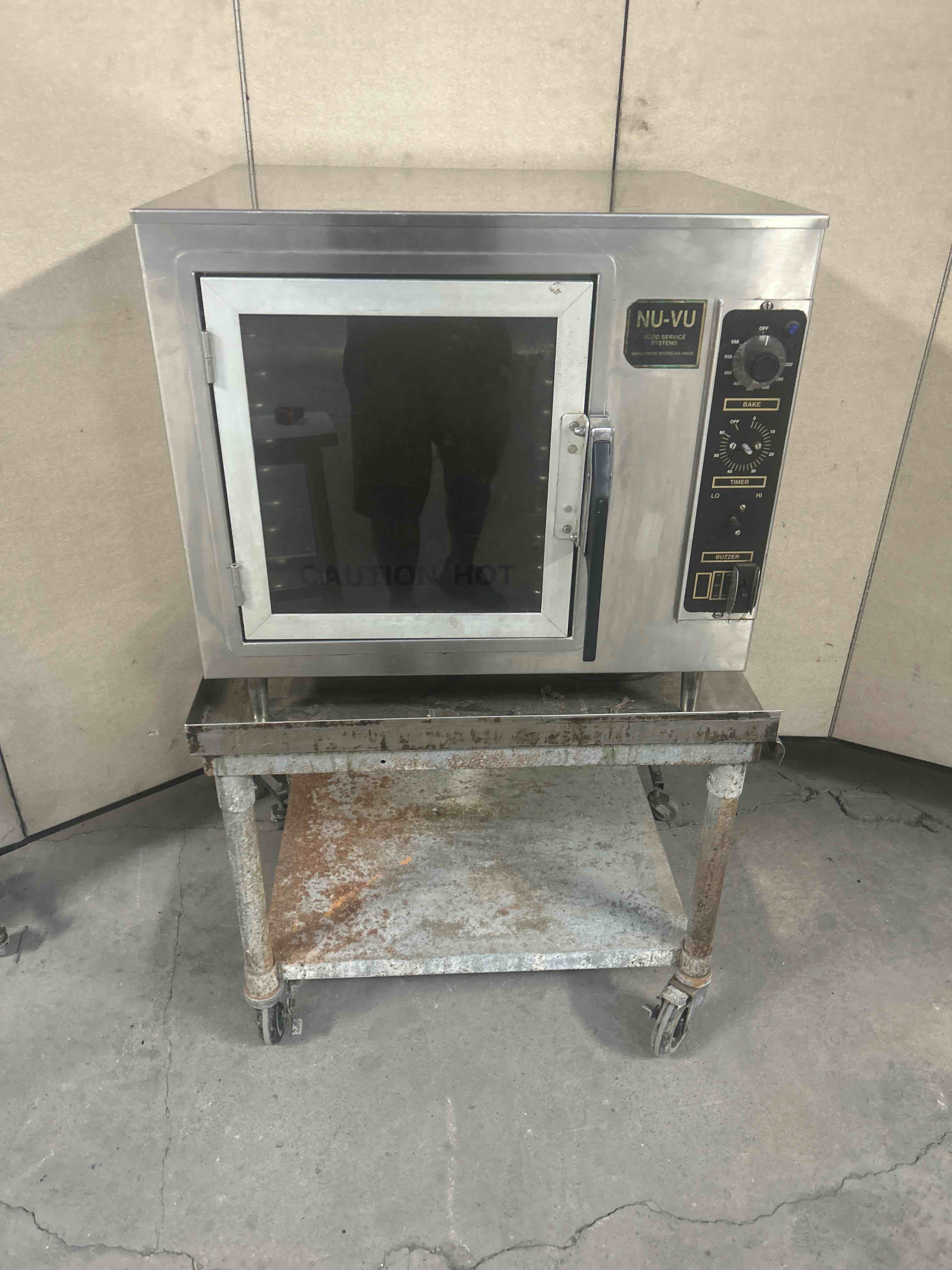 NUVU STAINLESS STEEL CONVECTION OVEN ON EQUIPMENT STAND WITH CASTERS